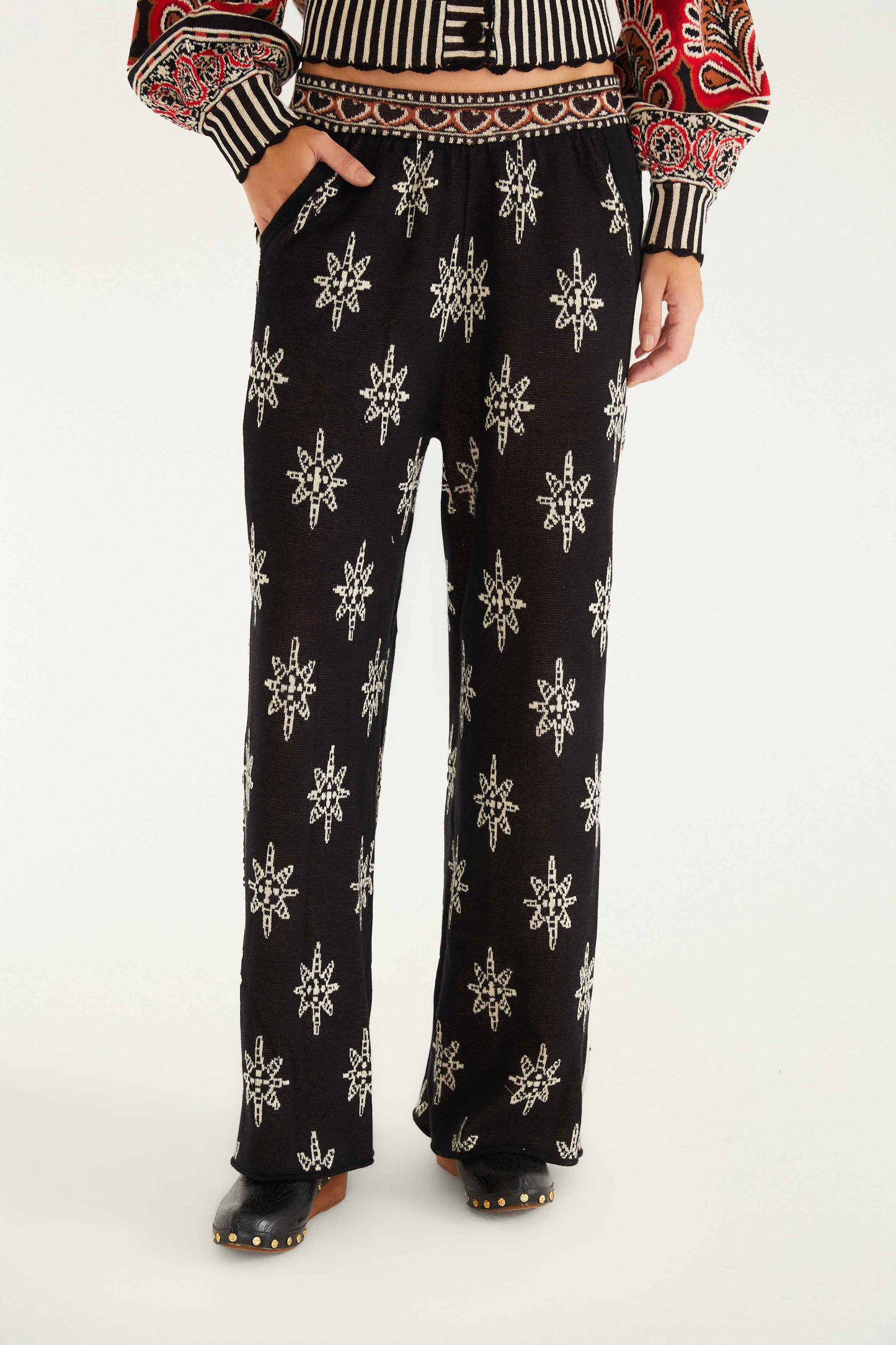 FARM Rio model wearing the Black Ainika Love Coconut Groove Knit Pants