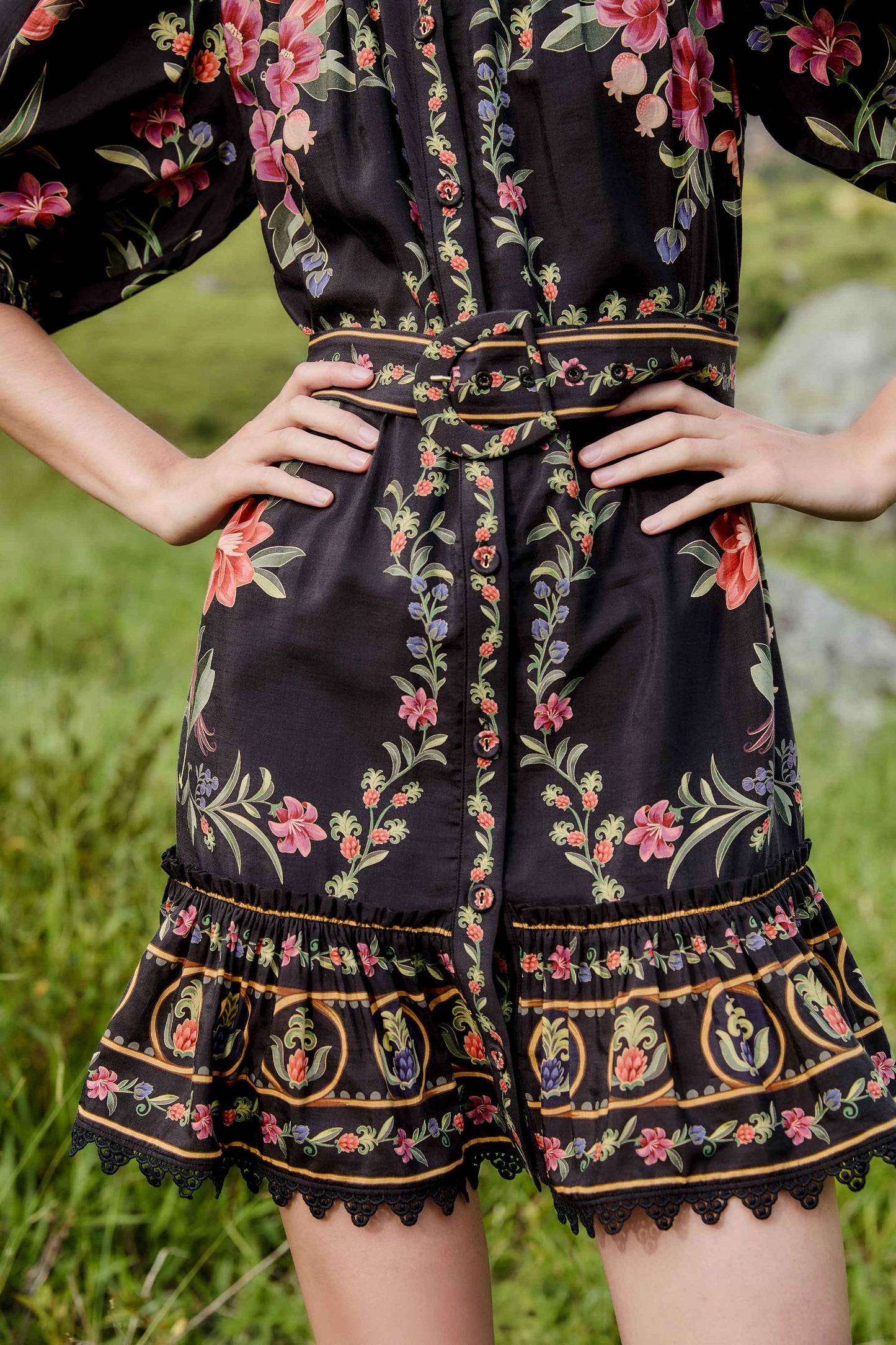 FARM Rio model wearing the Black Belle Garden Lace Belted Mini Dress