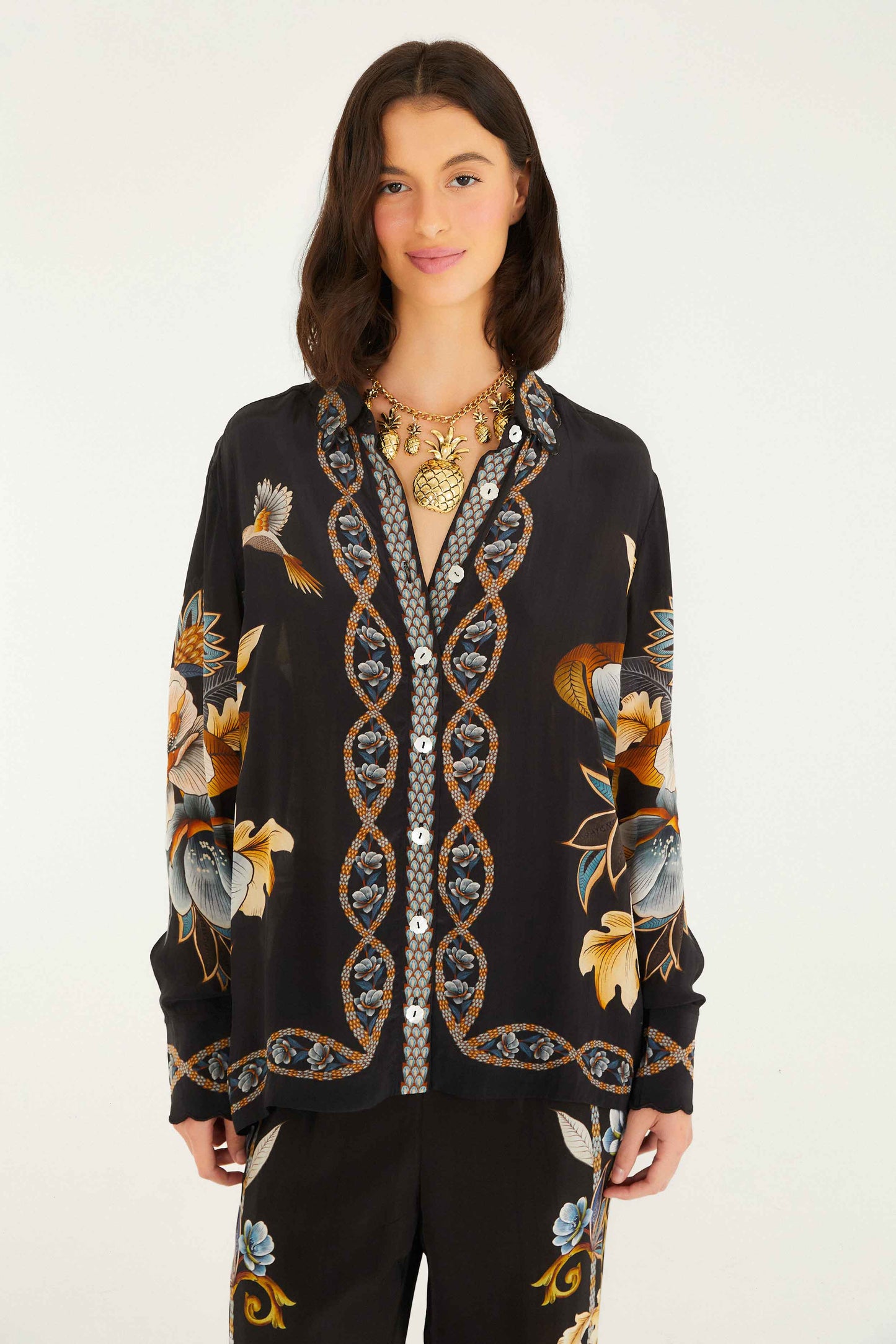 FARM Rio model wearing the Black Floral Snake Pajama Shirt