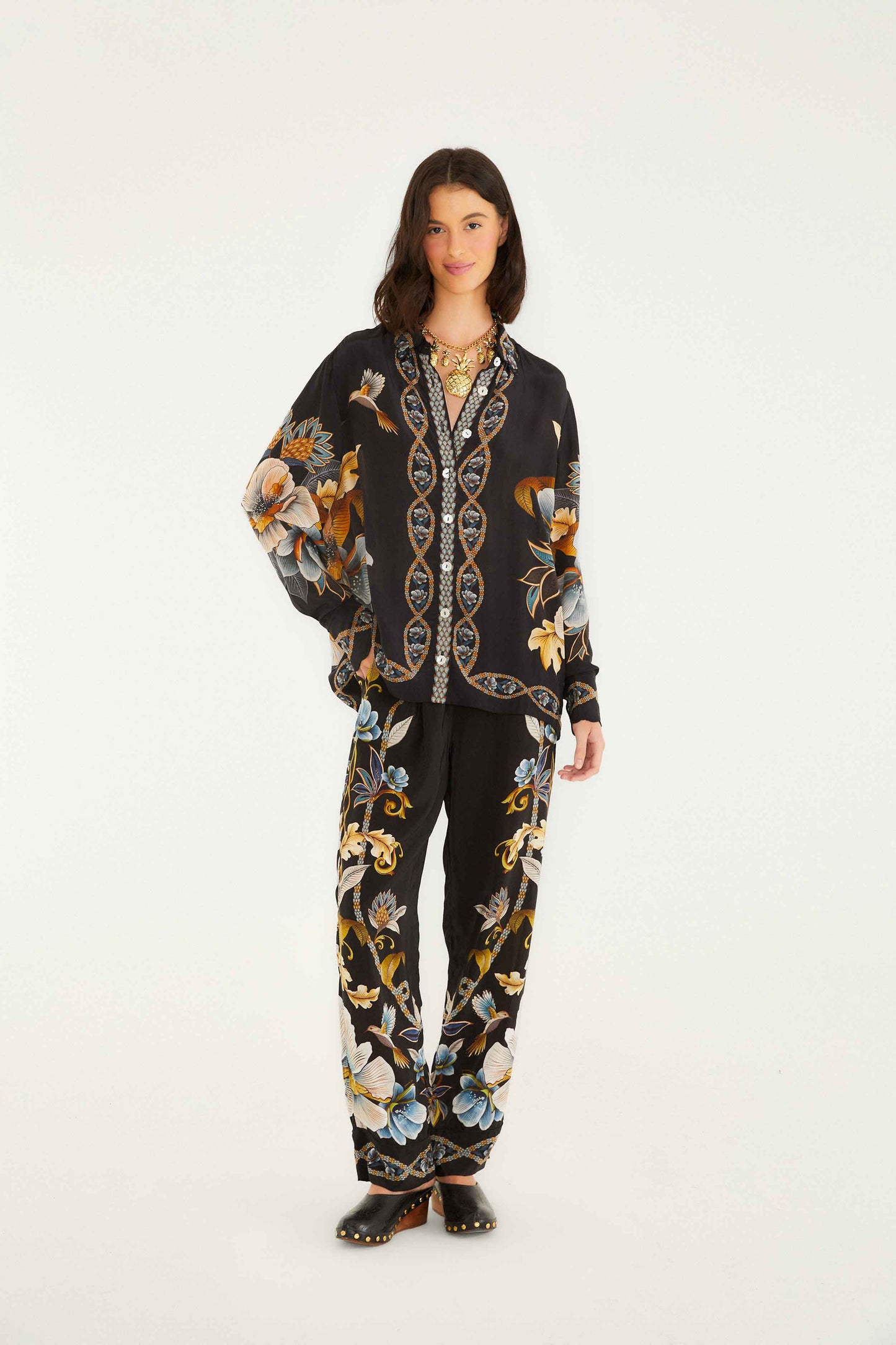 FARM Rio model wearing the Black Floral Snake Pajama Shirt