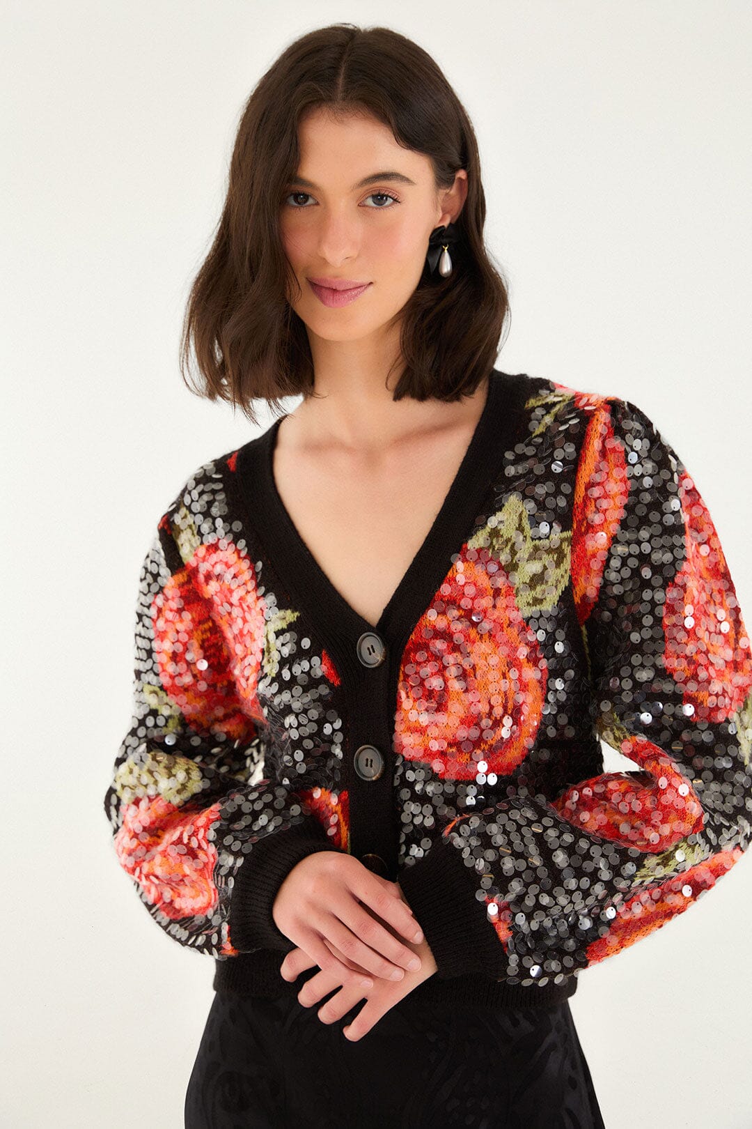FARM Rio model wearing the Black Latin Roses Buttoned Sequined Knit Cardigan