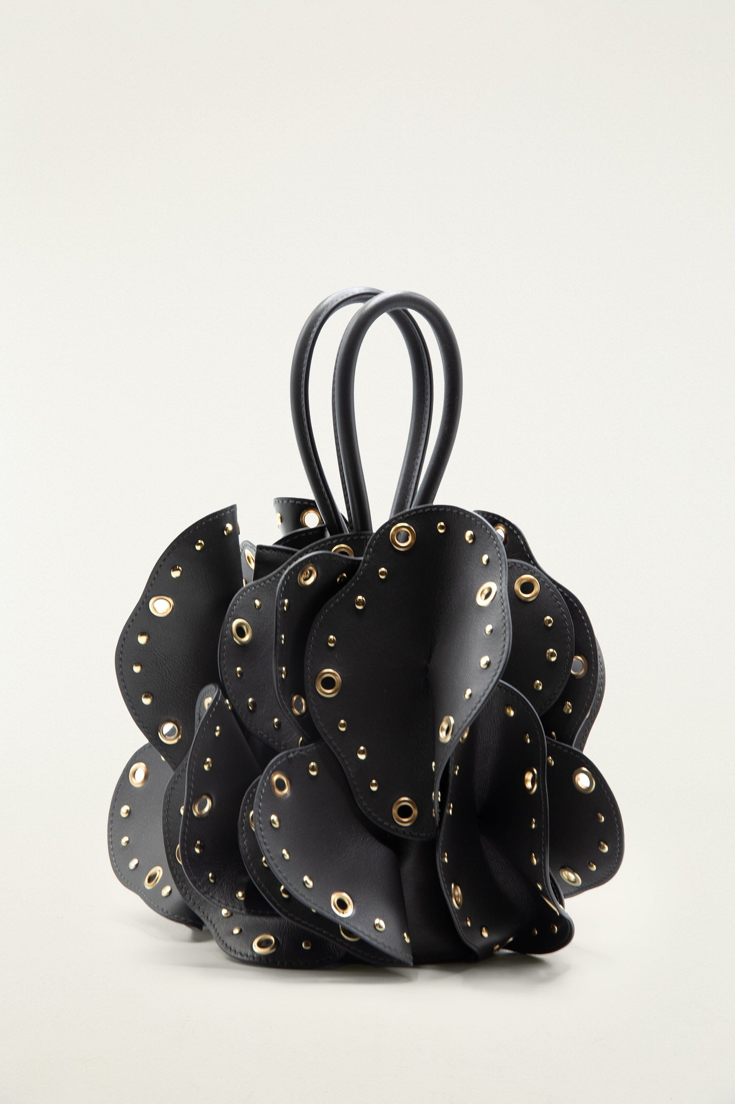 FARM Rio model wearing the Black Leather Studded Flower Bag