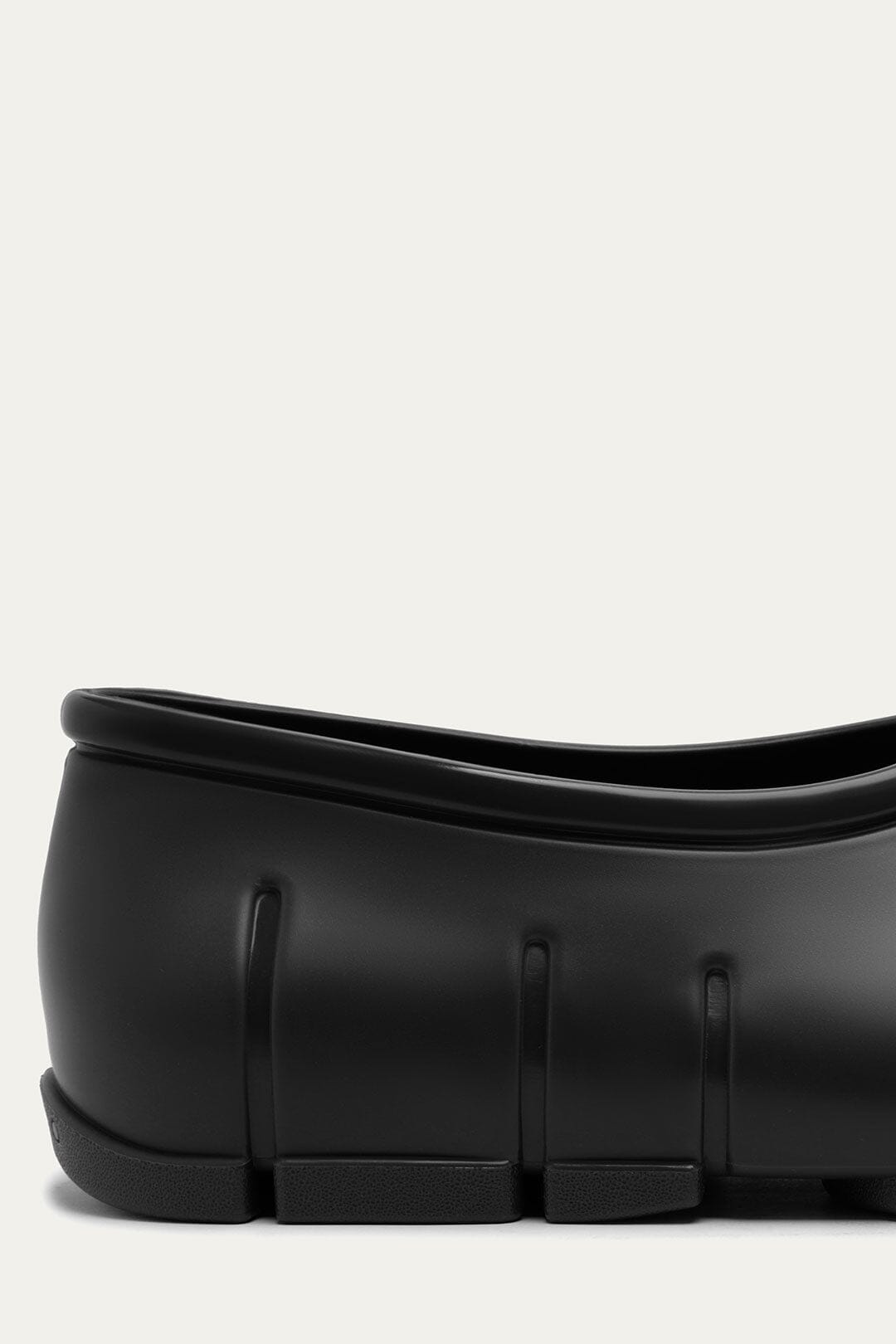 FARM Rio model wearing the Black Monstera Rain Shoe