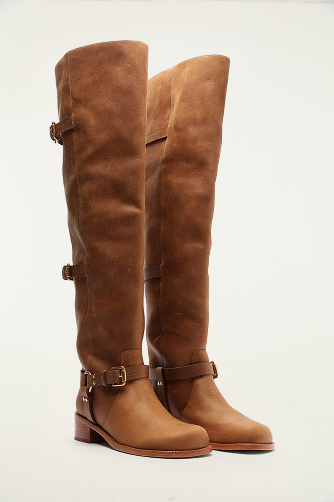 FARM Rio model wearing the Brown Distressed Leather Buckled Over-The-Knee Boot