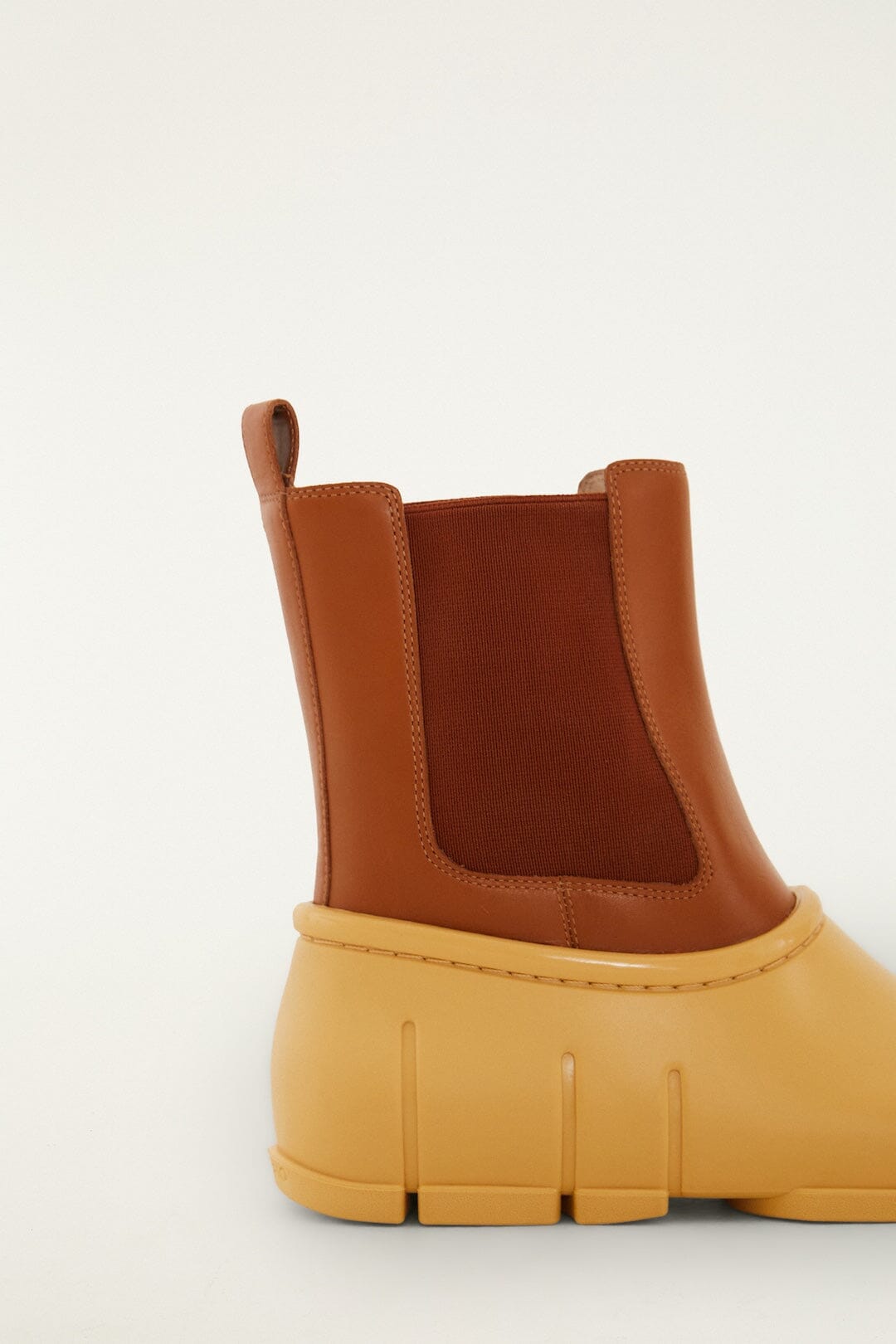 FARM Rio model wearing the Butter Yellow Monstera Rain Chelsea Boot