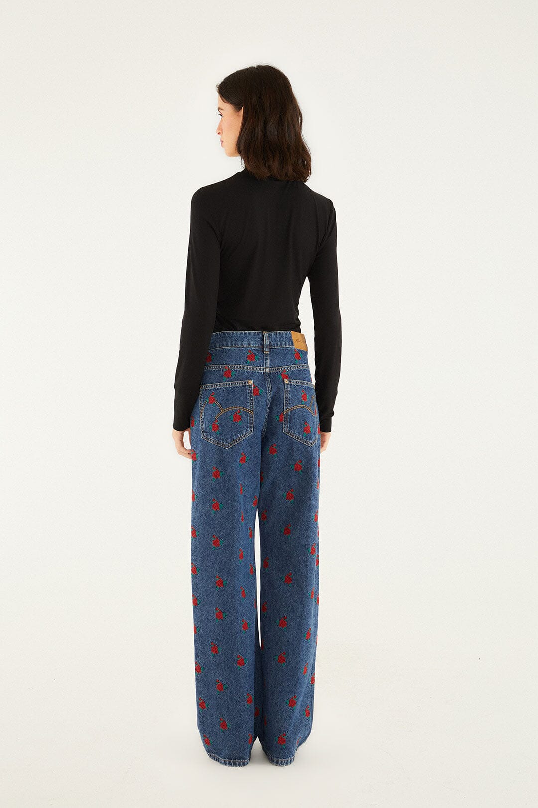 FARM Rio model wearing the Denim Embroidered Flowers Pants