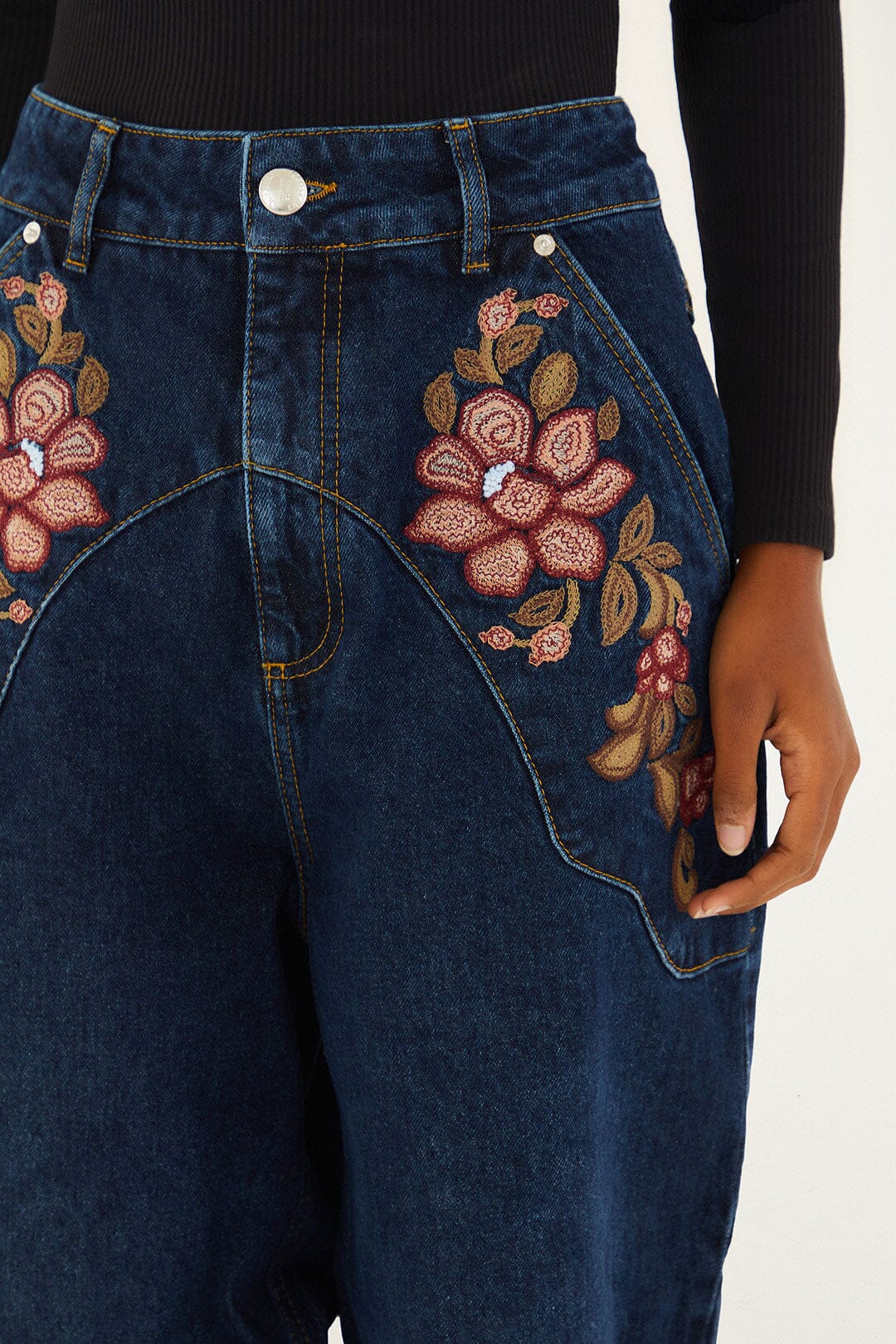 FARM Rio model wearing the Denim Floral Embroidery Pants