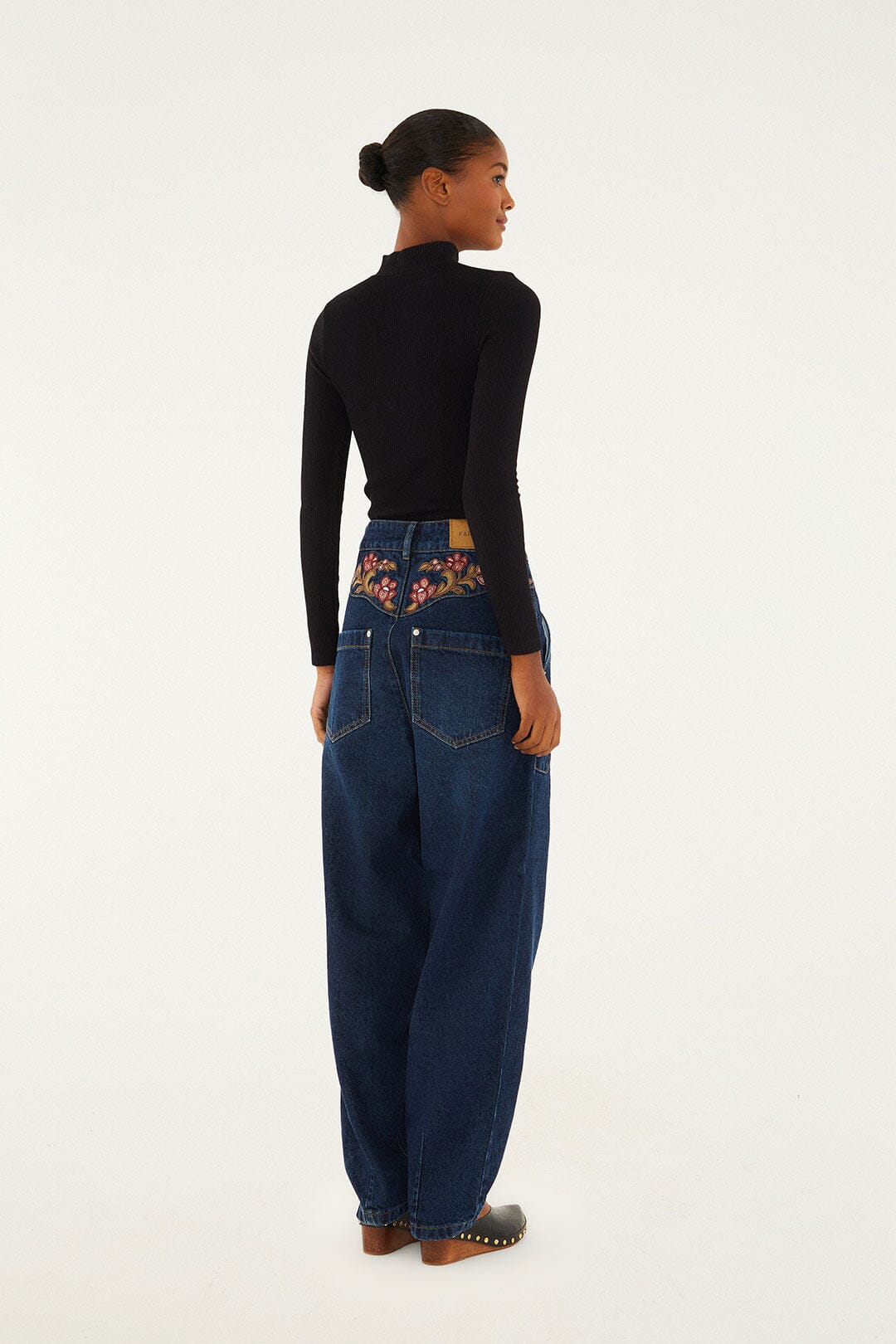 FARM Rio model wearing the Denim Floral Embroidery Pants