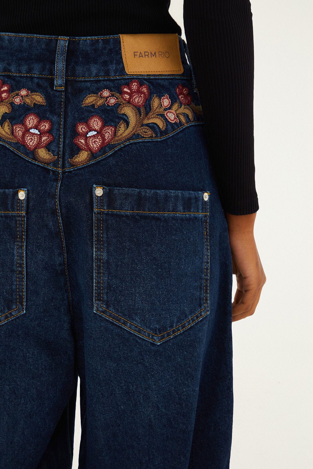 FARM Rio model wearing the Denim Floral Embroidery Pants