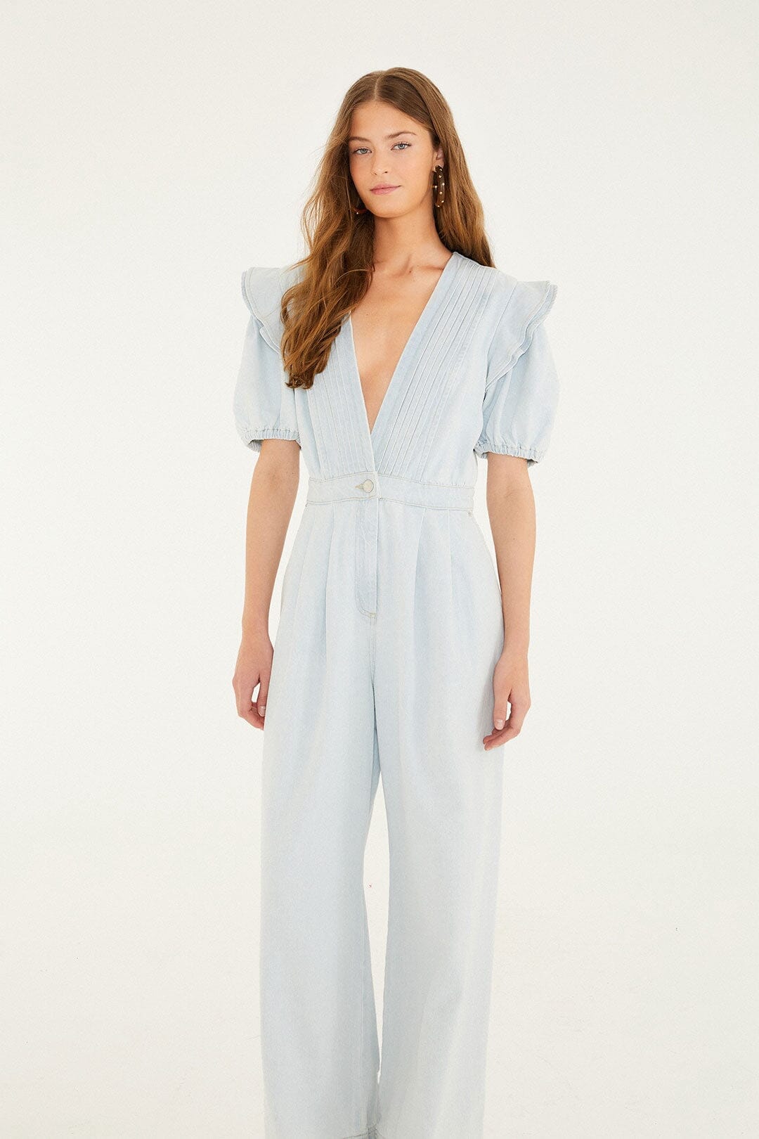 FARM Rio model wearing the Denim V Neck Pleated Ruffled Jumpsuit