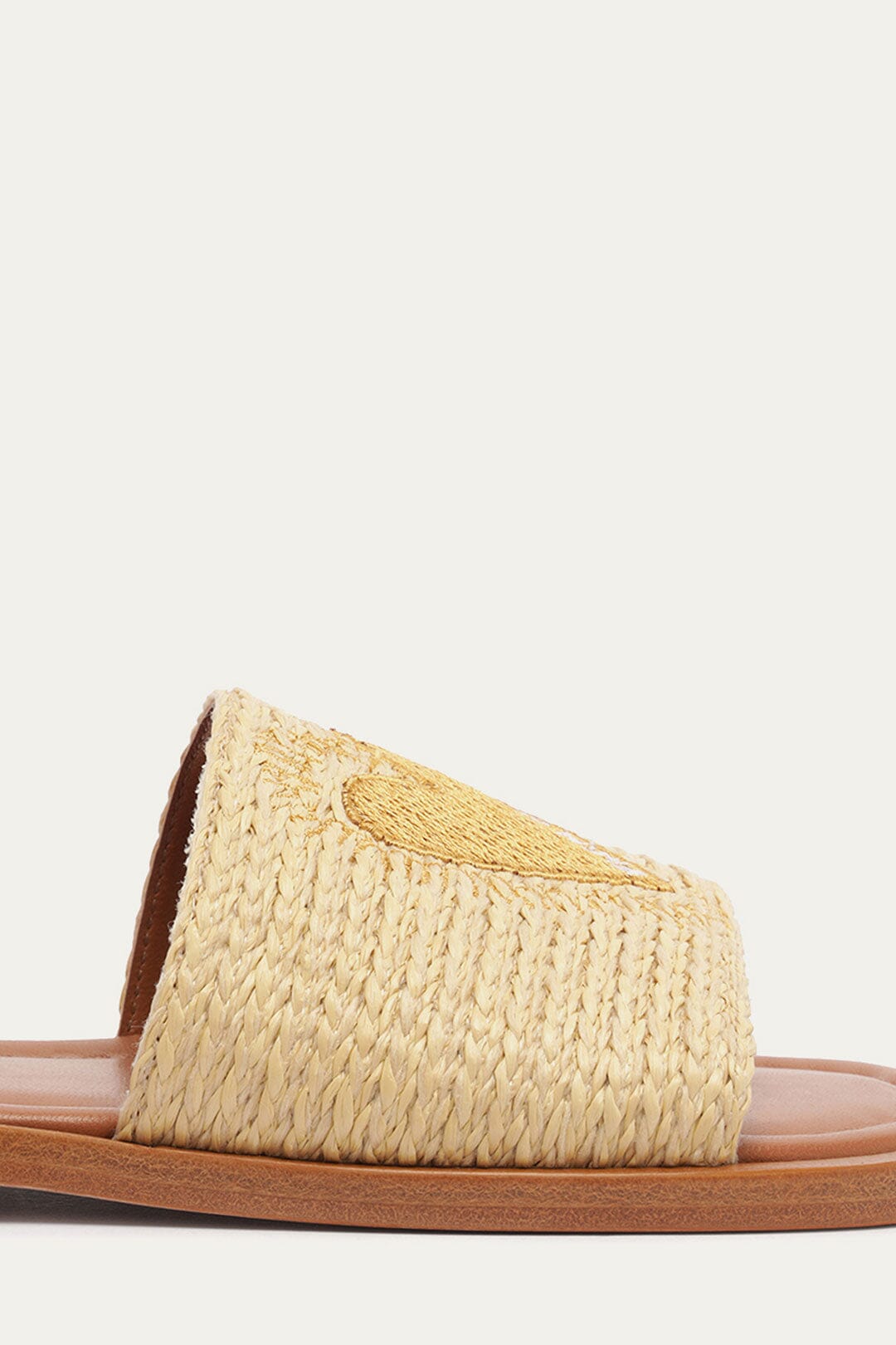 FARM Rio model wearing the Raffia Flat Sandal