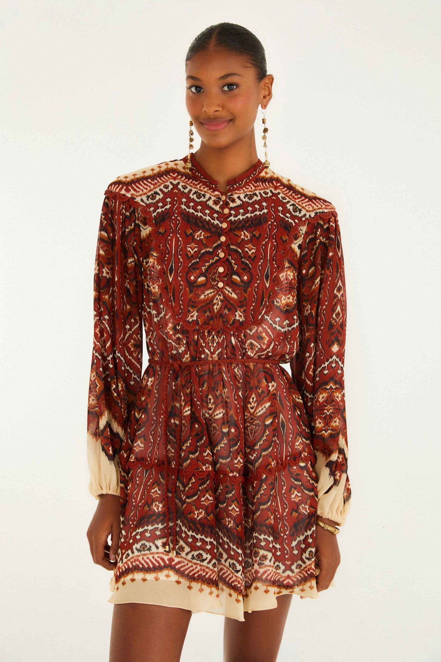 FARM Rio model wearing the Sand Ainika Pineapple Tapestry Long Sleeve Mini Dress