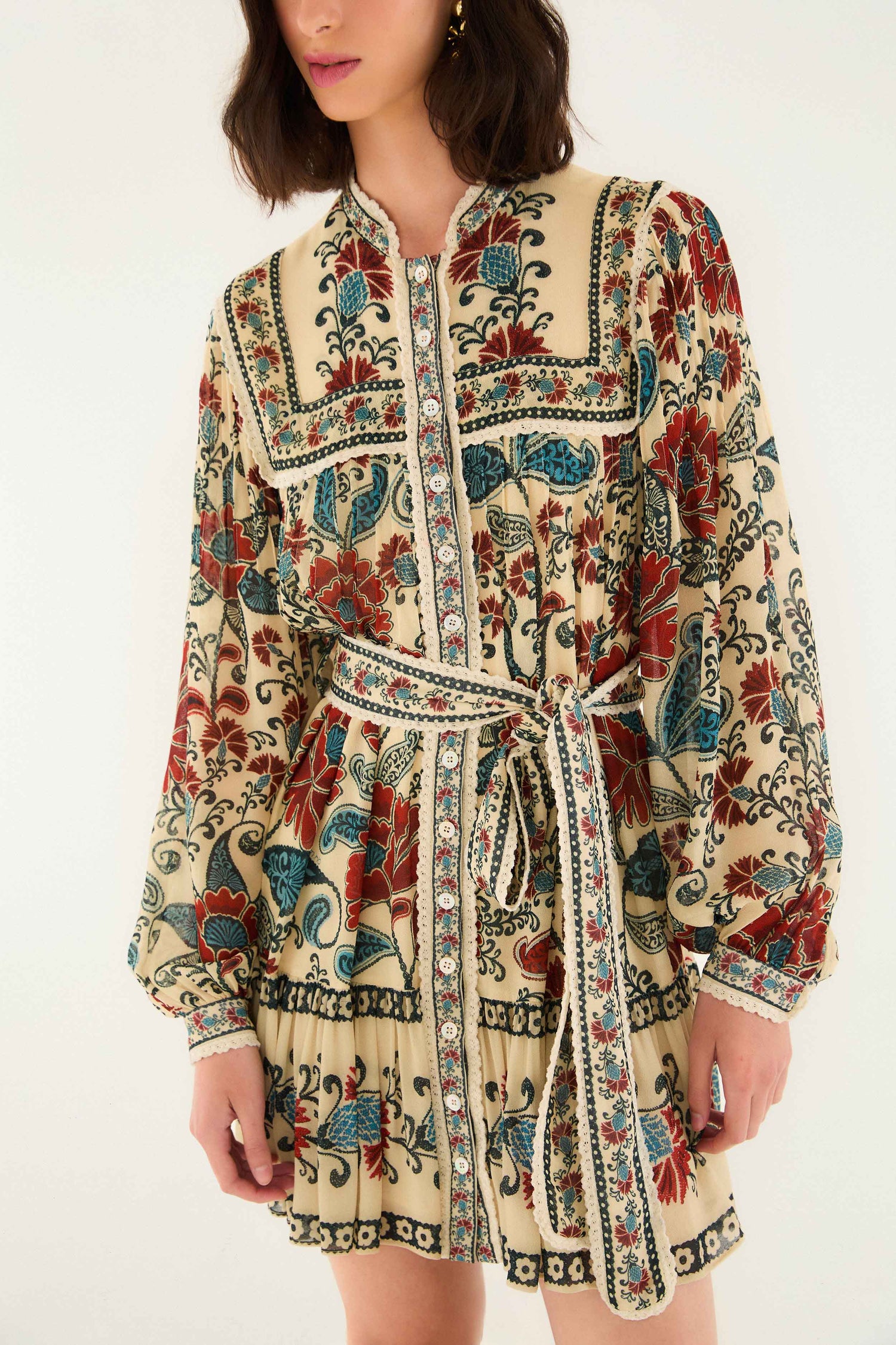 FARM Rio model wearing the Sand Francesca Long Sleeve Mini Dress