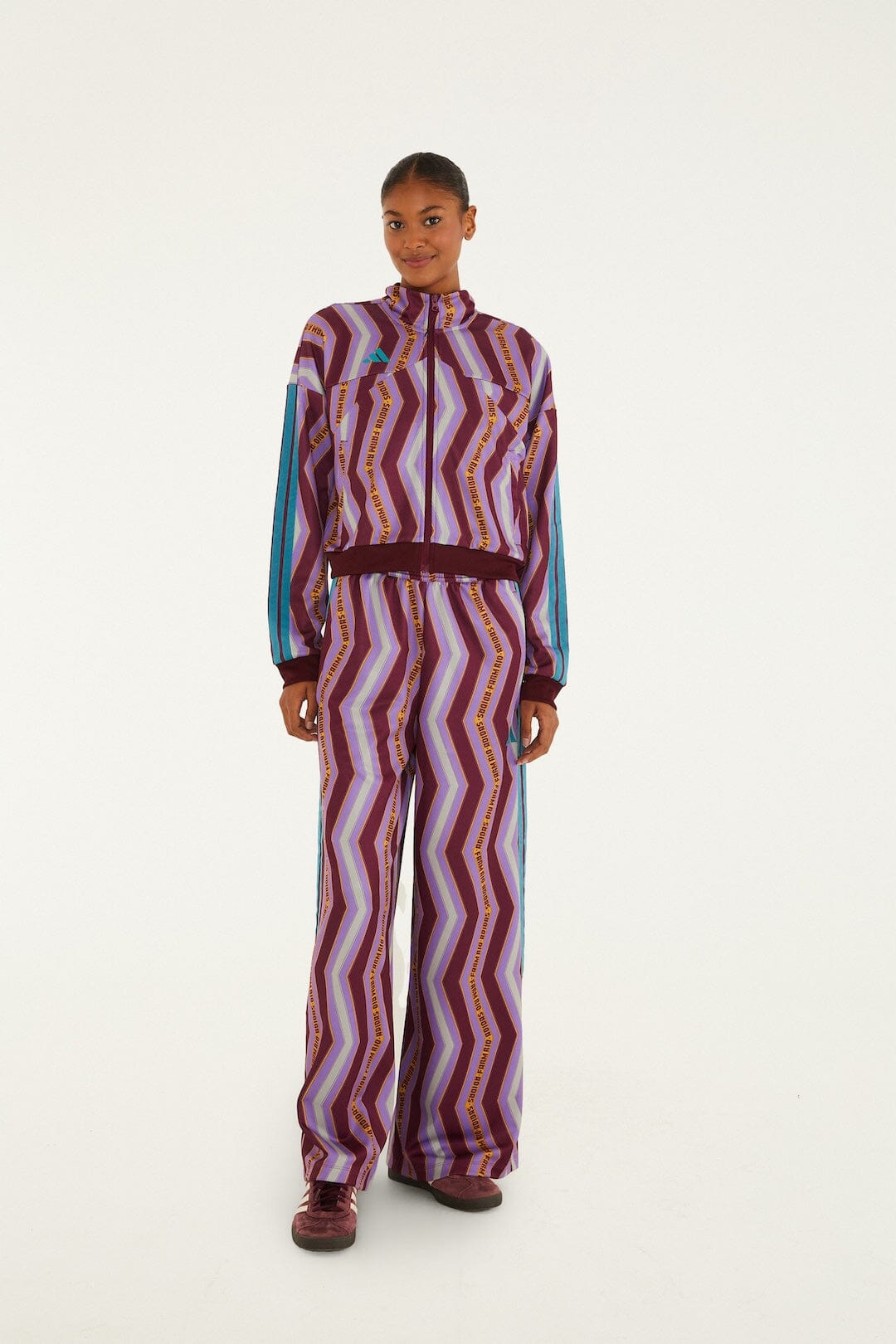 FARM Rio model wearing the Zig Zag Stripes Lilac Adidas Tiro Jacket