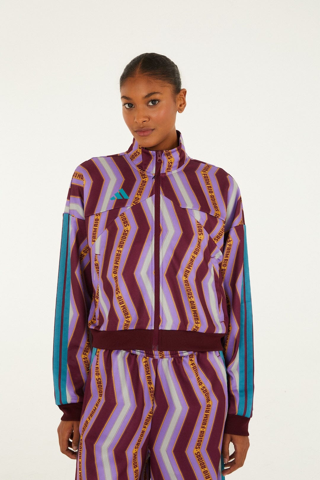 FARM Rio model wearing the Zig Zag Stripes Lilac Adidas Tiro Jacket