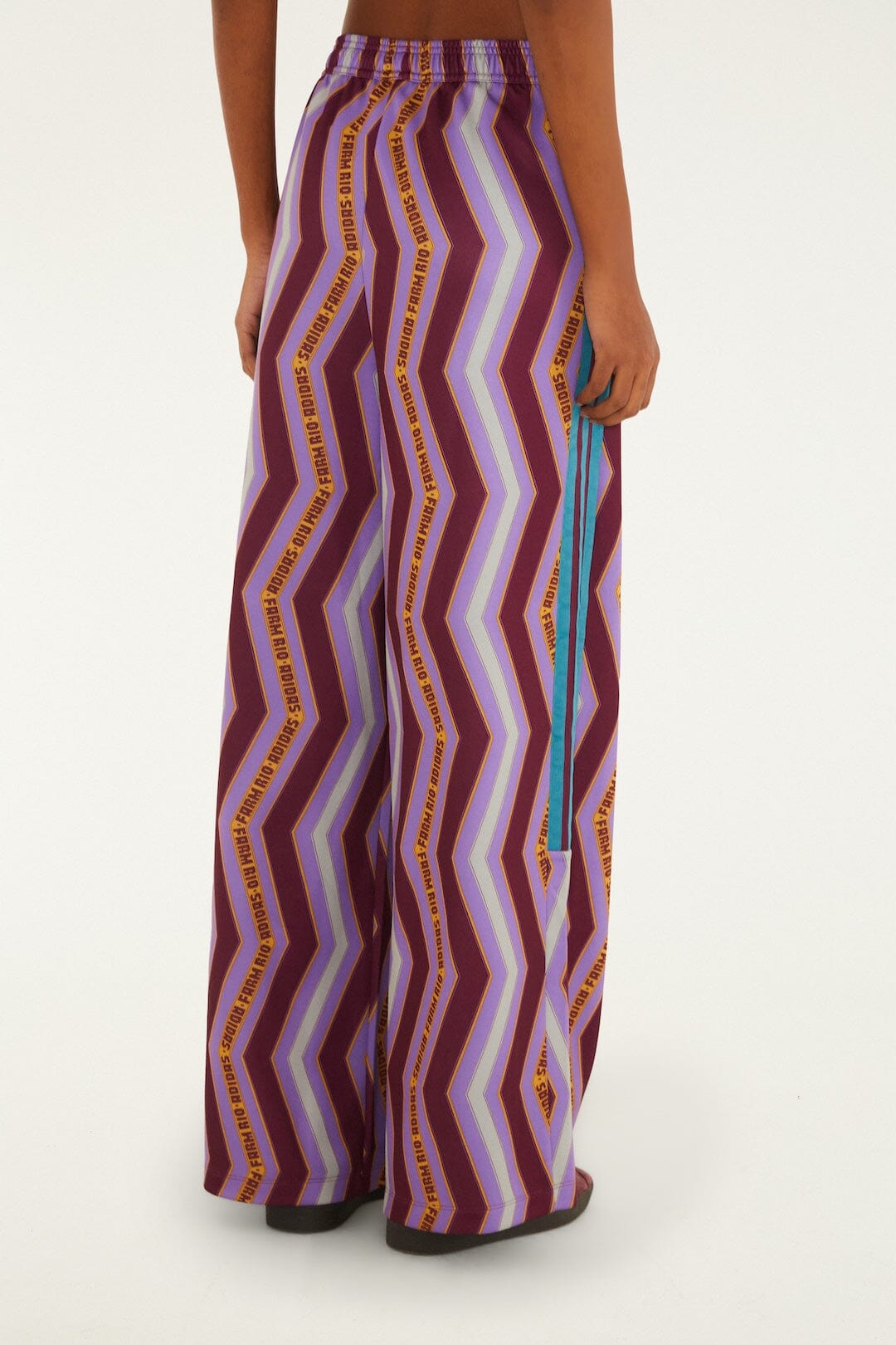FARM Rio model wearing the Zig Zag Stripes Lilac Adidas Tiro Pants