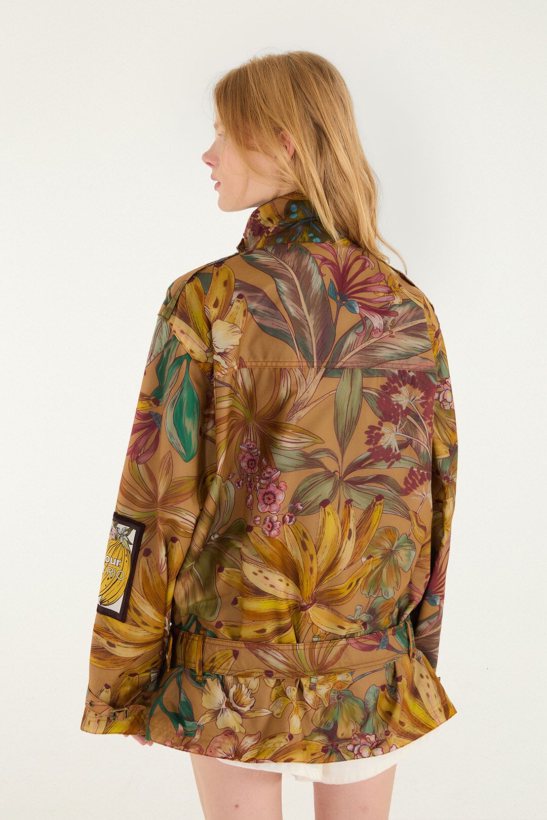 FARM Rio model wearing the Banana Groove High Neck Wax Coat