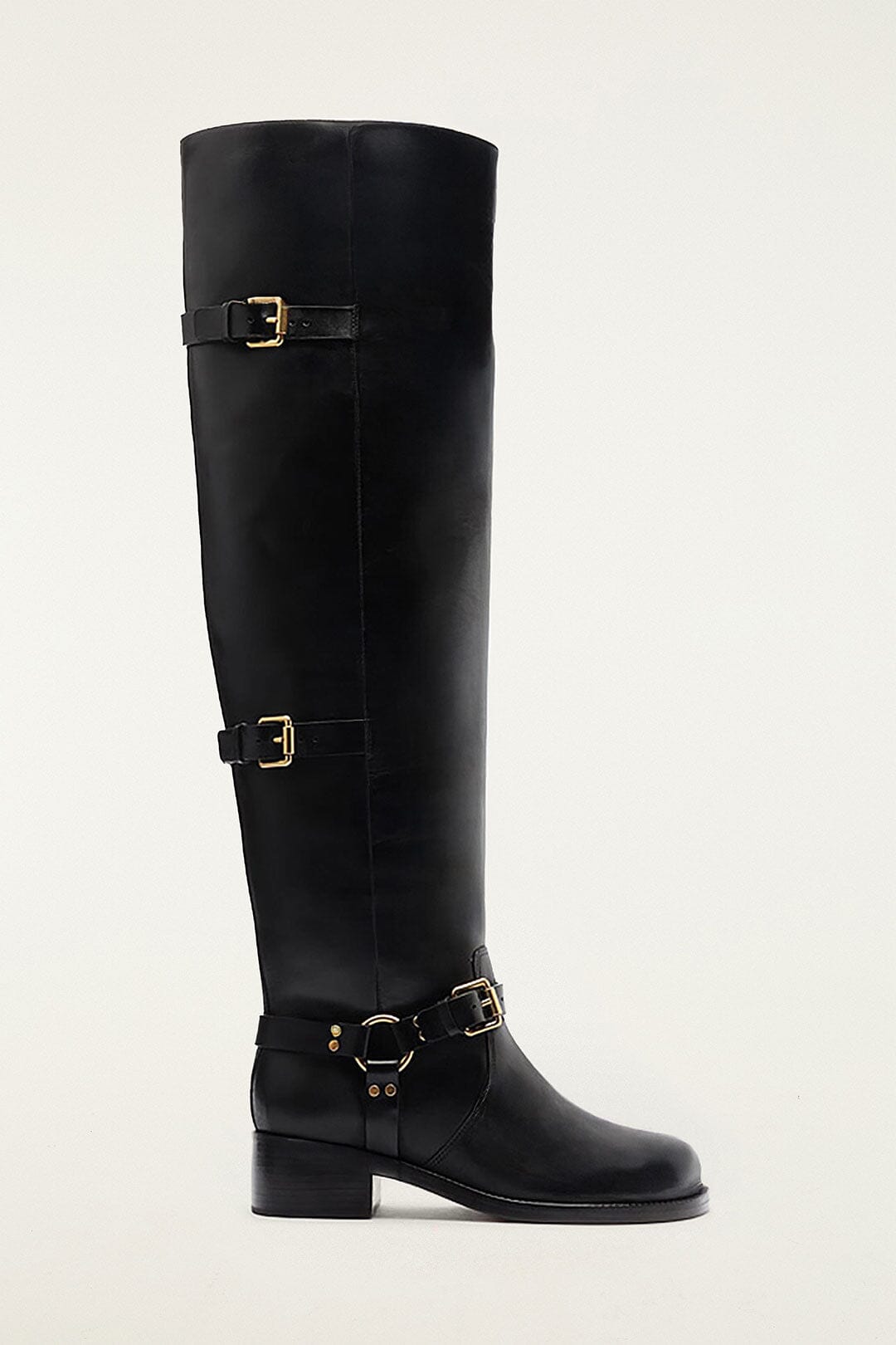 FARM Rio model wearing the Black Distressed Leather Buckled Over-The-Knee Boot