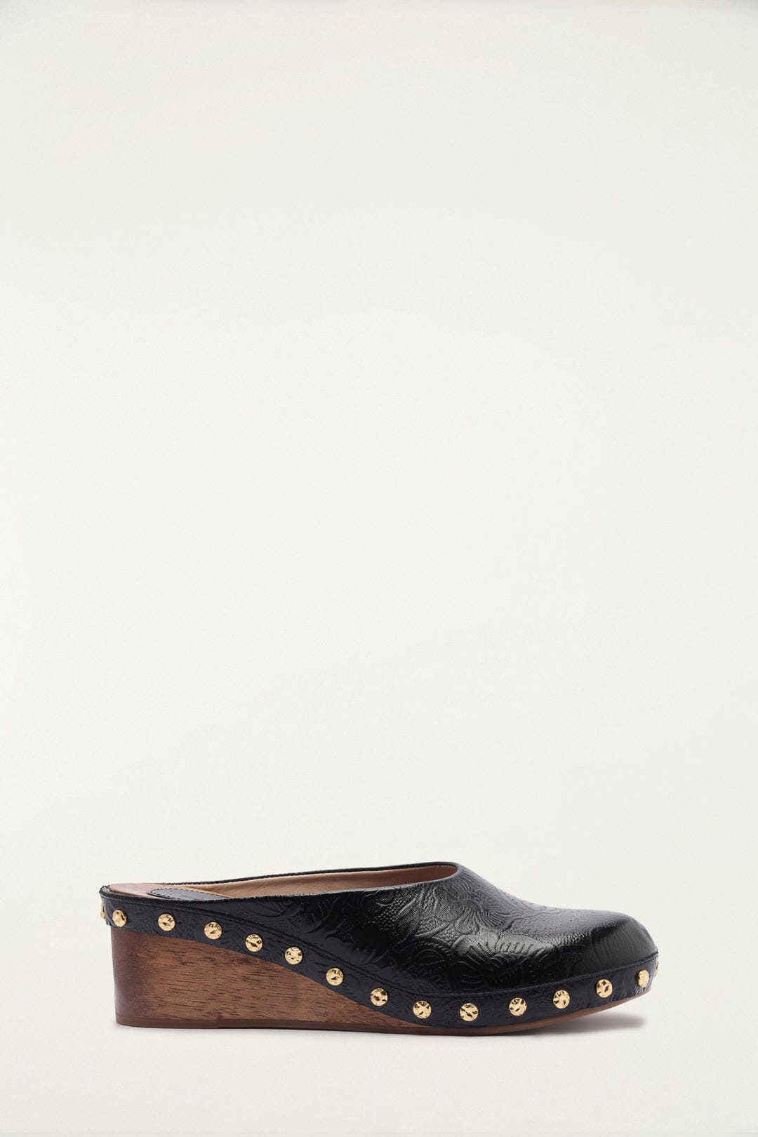 FARM Rio model wearing the Black Embossed Wedge Clog