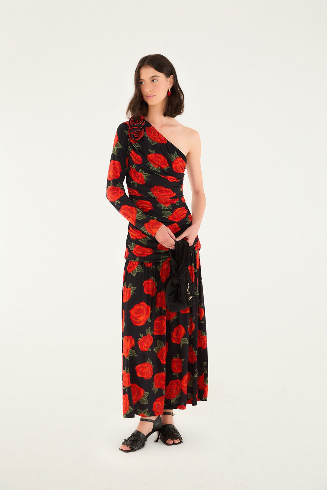 FARM Rio model wearing the Black Latin Roses 3d Flower One-Shoulder Draped Maxi Dress