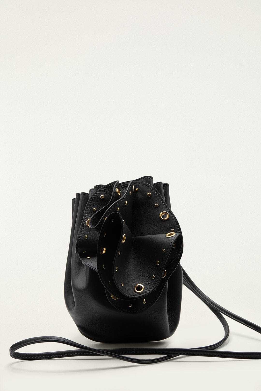 FARM Rio model wearing the Black Leather Studded Crossbody Flower Bag