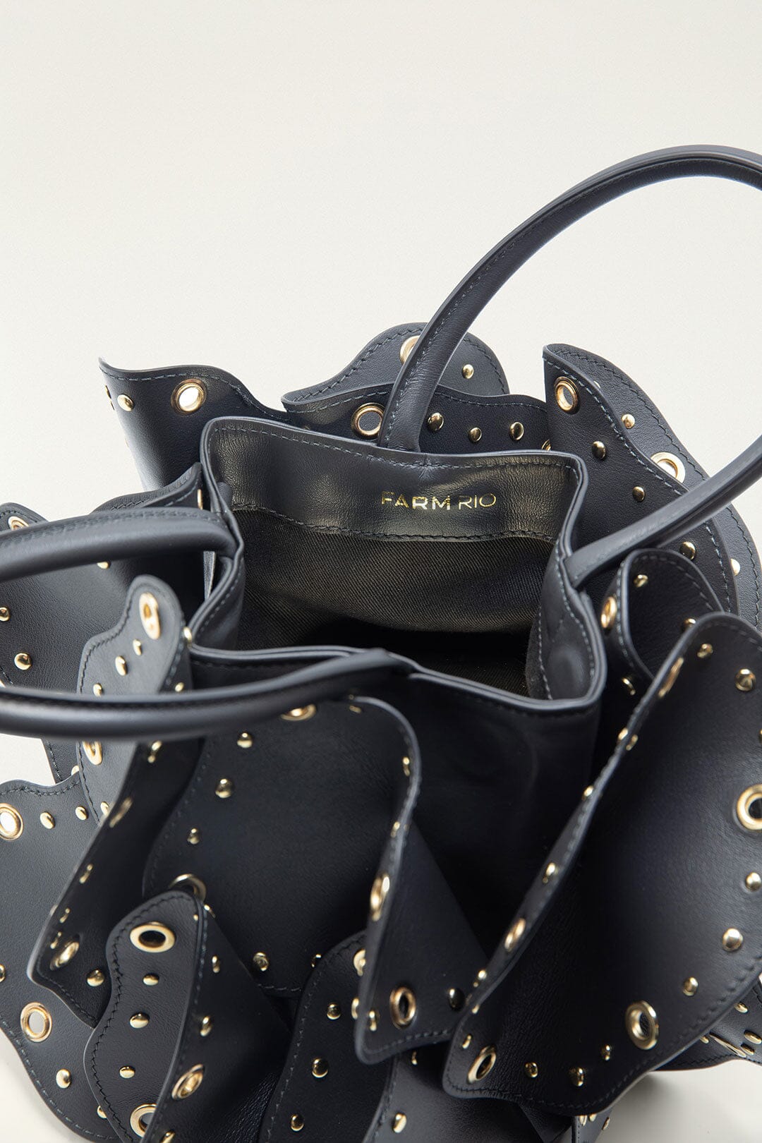 FARM Rio model wearing the Black Leather Studded Flower Bag