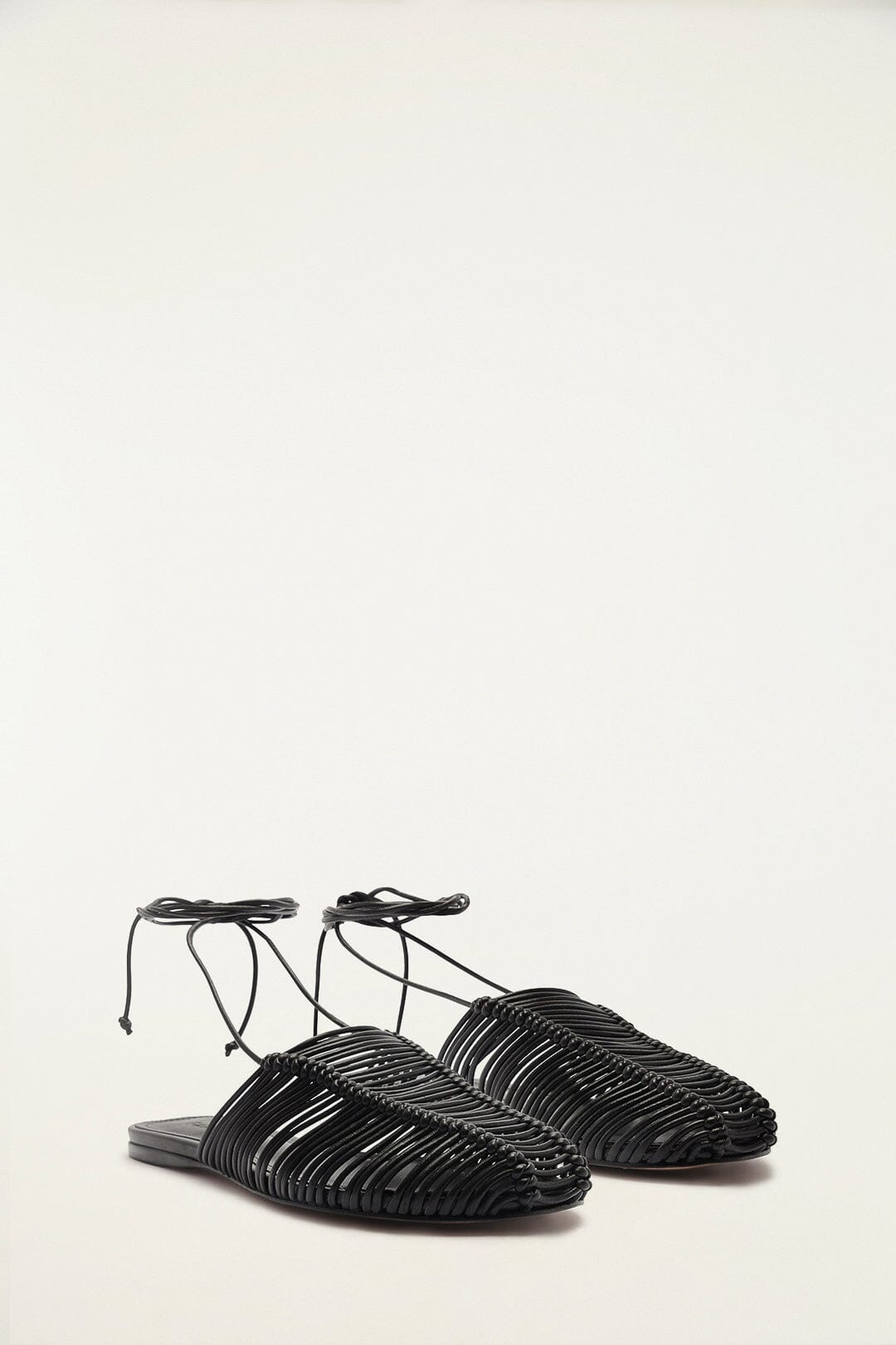 FARM Rio model wearing the Black Macrame Mule