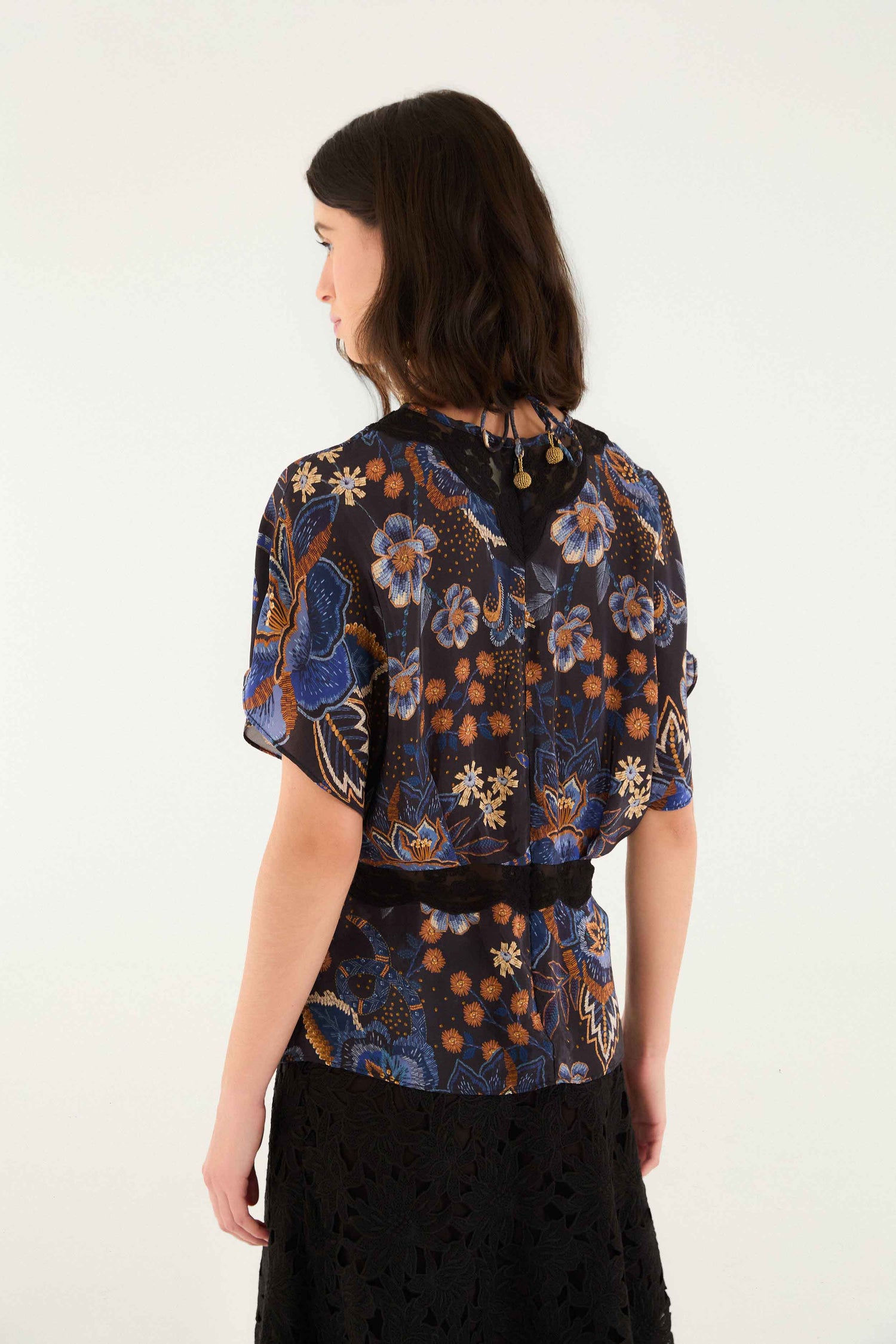 FARM Rio model wearing the Black Snakes Bouquet Blouse