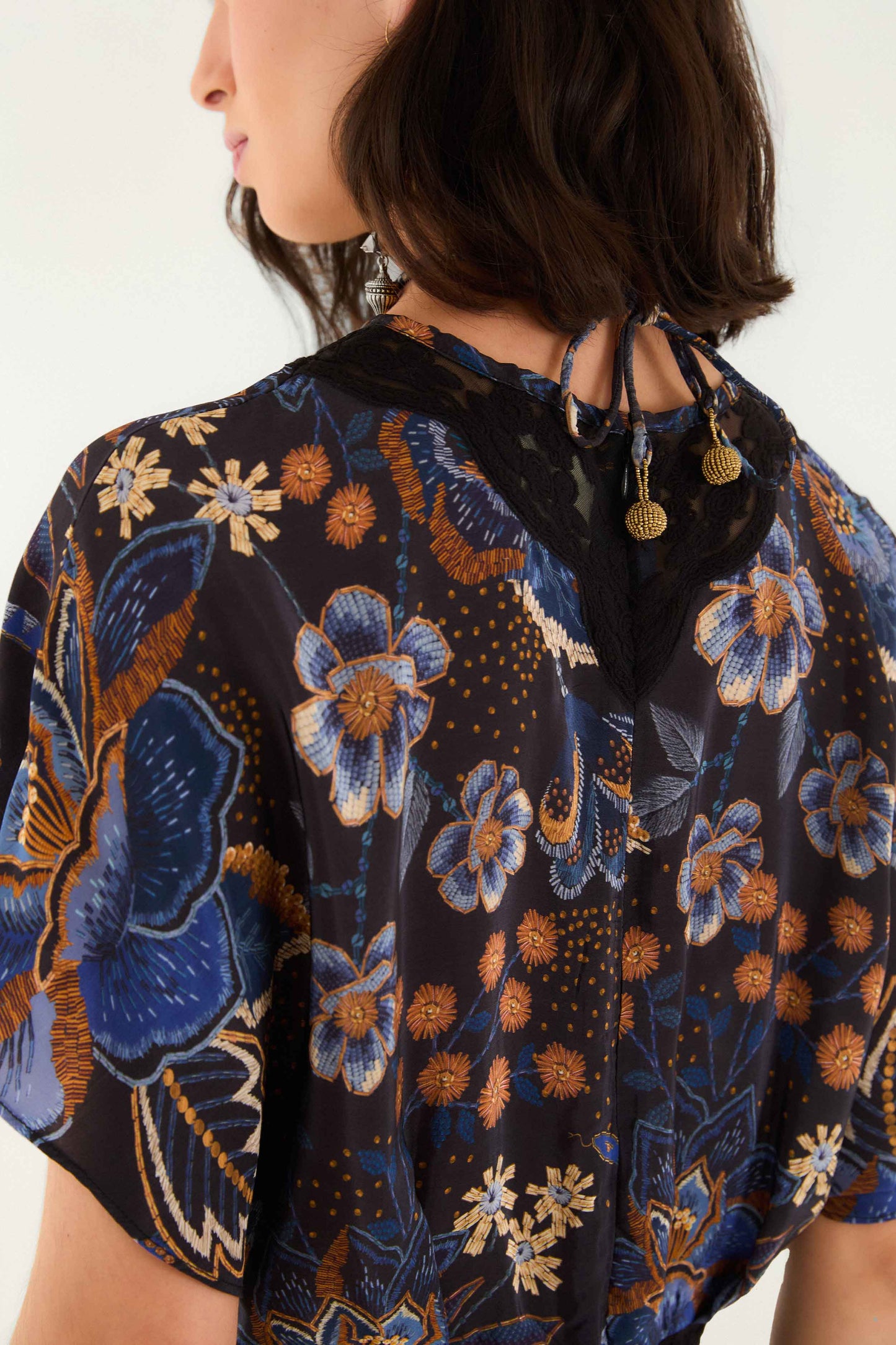 FARM Rio model wearing the Black Snakes Bouquet Blouse