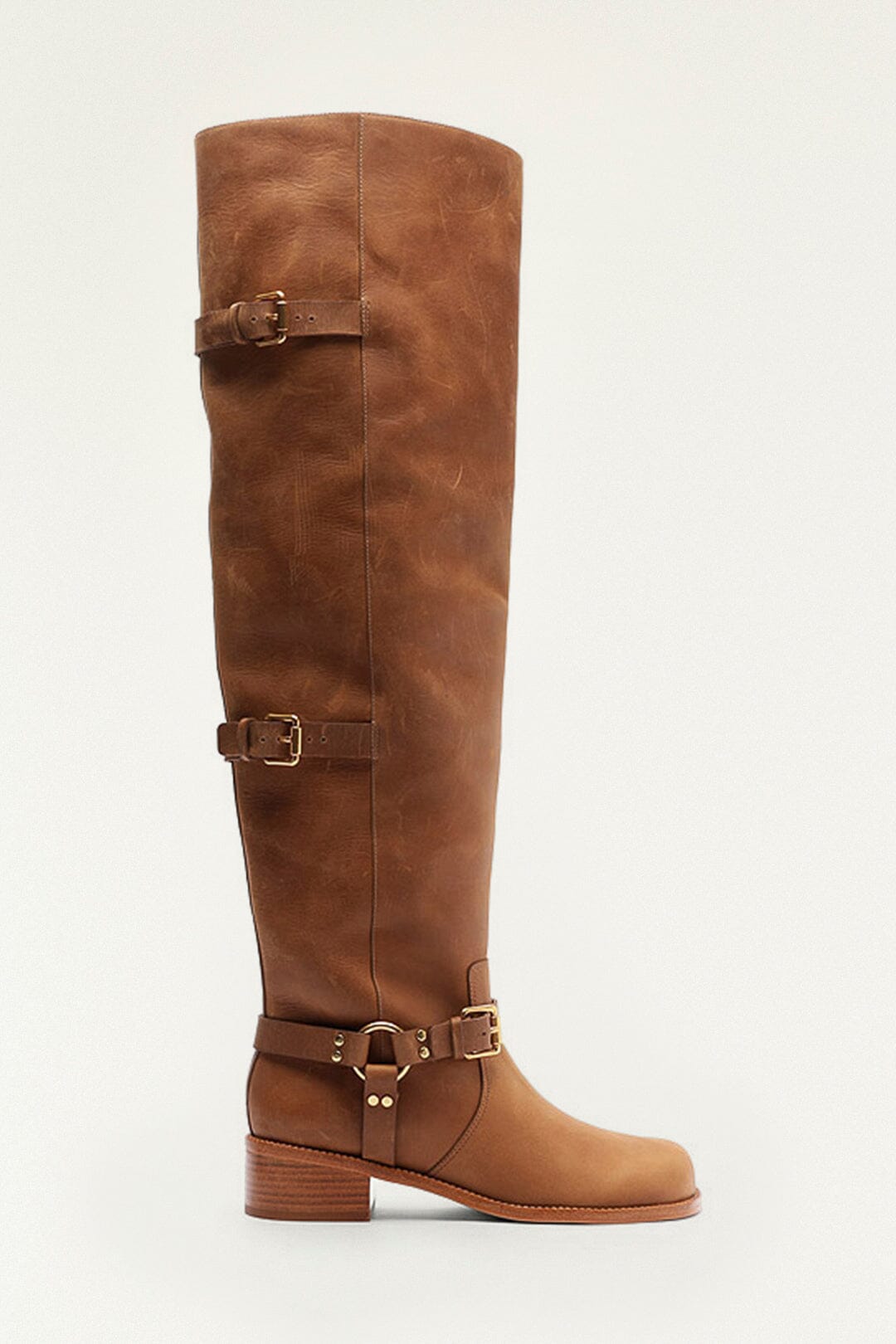 FARM Rio model wearing the Brown Distressed Leather Buckled Over-The-Knee Boot