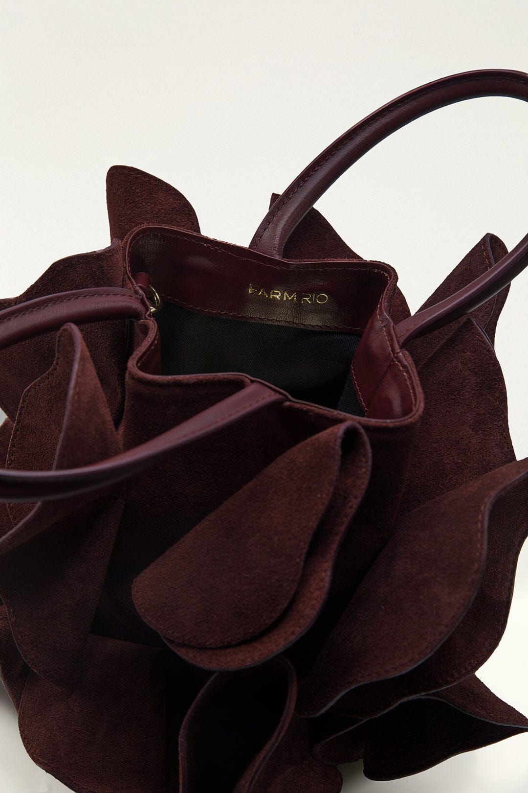 FARM Rio model wearing the Brown Leather Flower Bag