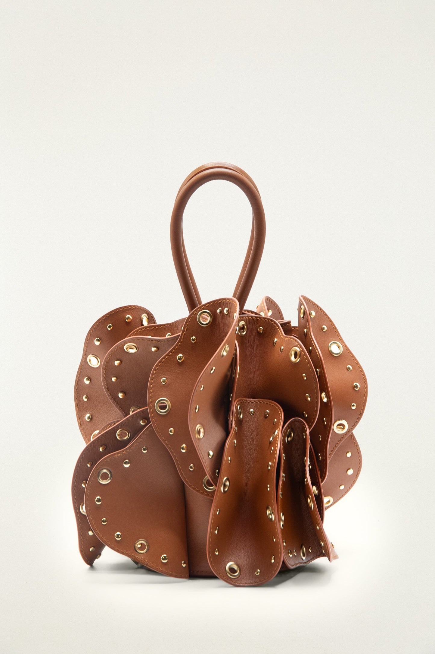 FARM Rio model wearing the Brown Leather Studded Flower Bag