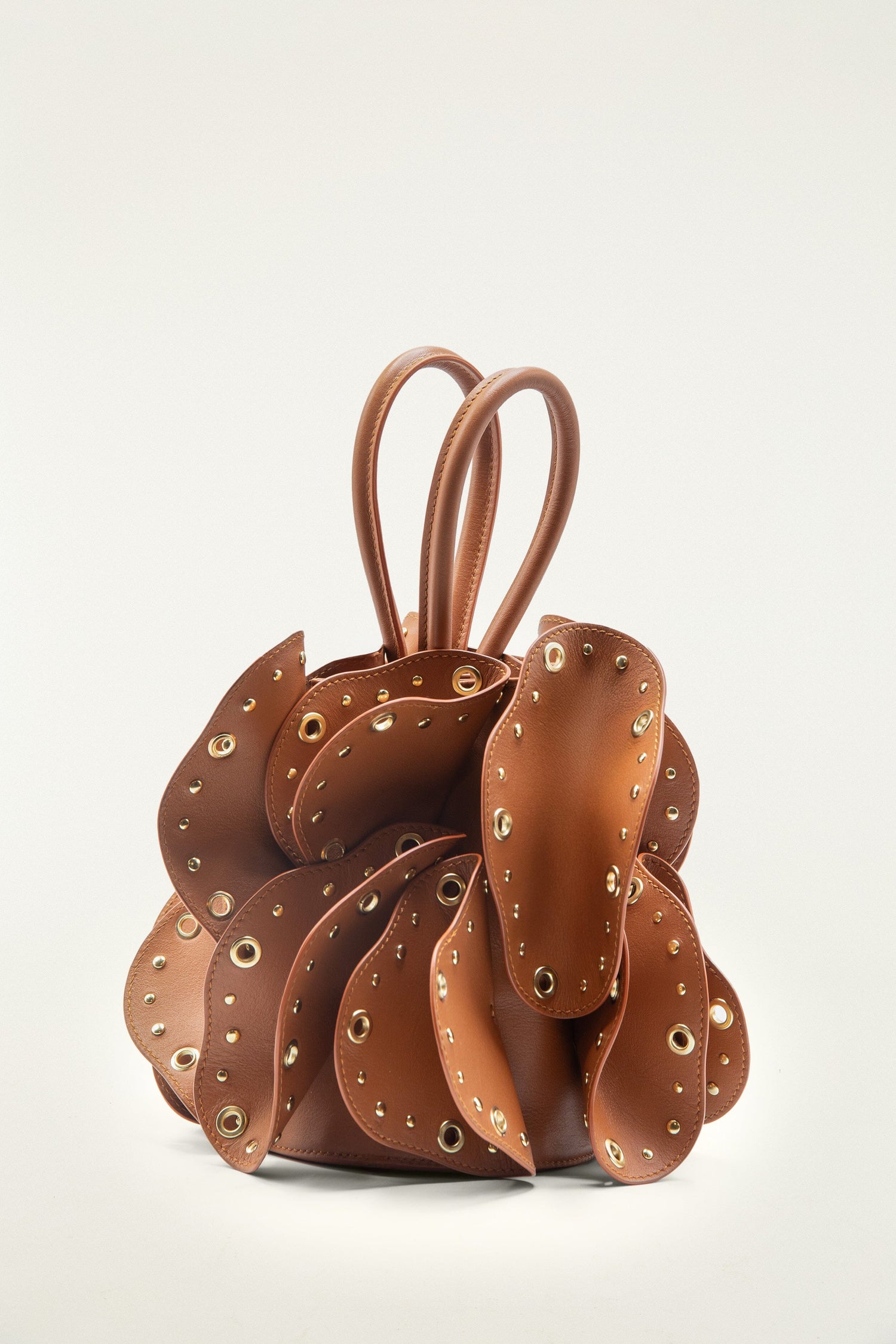 FARM Rio model wearing the Brown Leather Studded Flower Bag