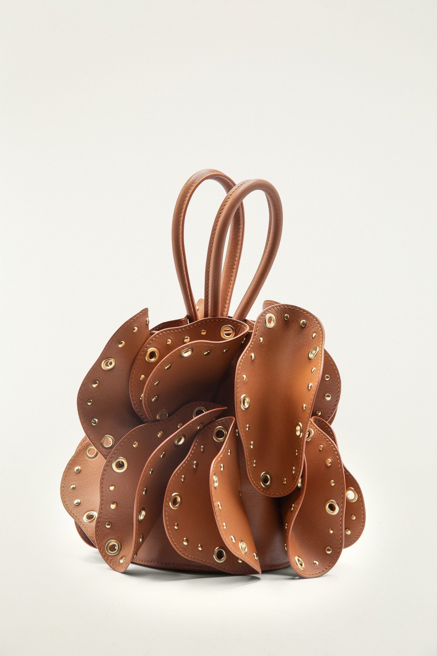 FARM Rio model wearing the Brown Leather Studded Flower Bag