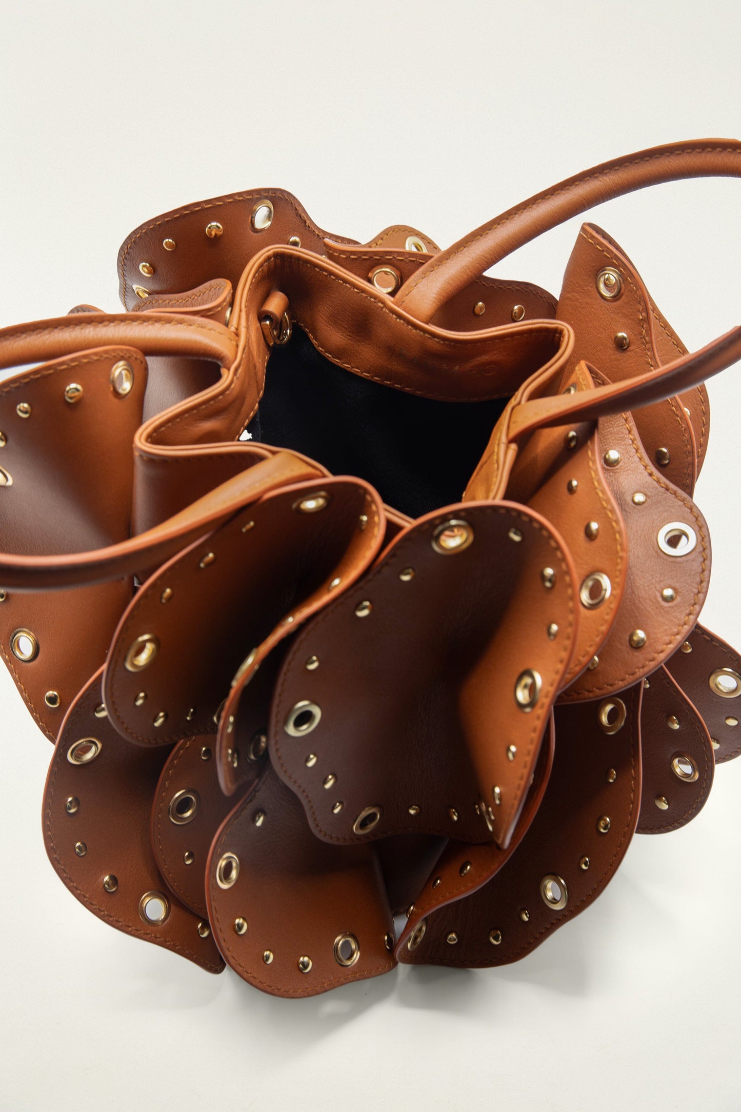FARM Rio model wearing the Brown Leather Studded Flower Bag