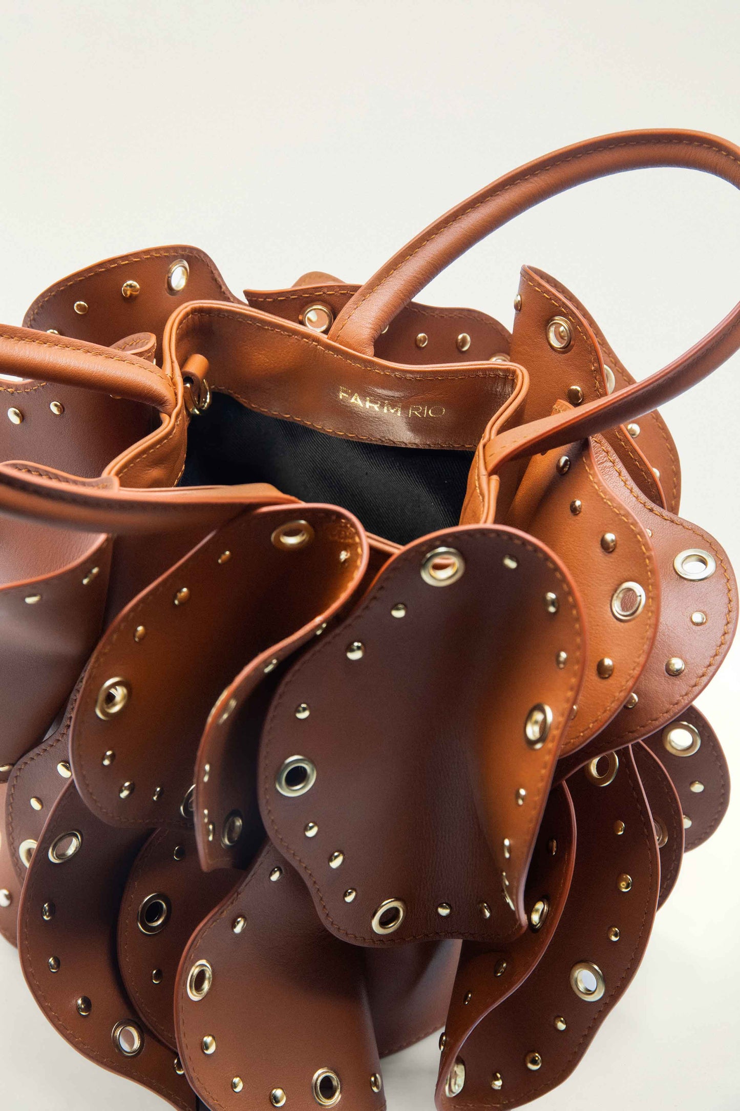 FARM Rio model wearing the Brown Leather Studded Flower Bag