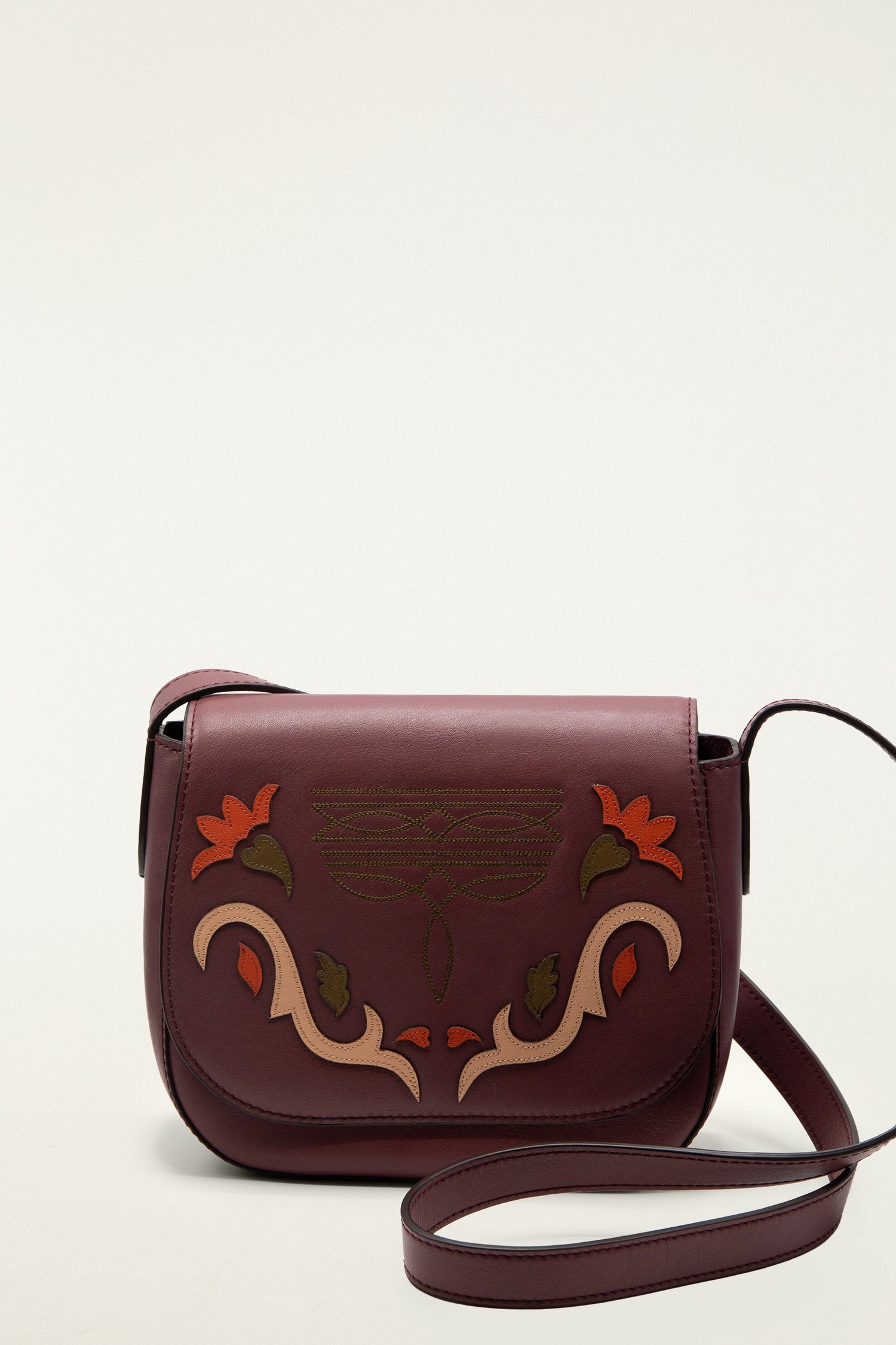 FARM Rio model wearing the Burgundy Western Embroidered Leather Crossbody Bag