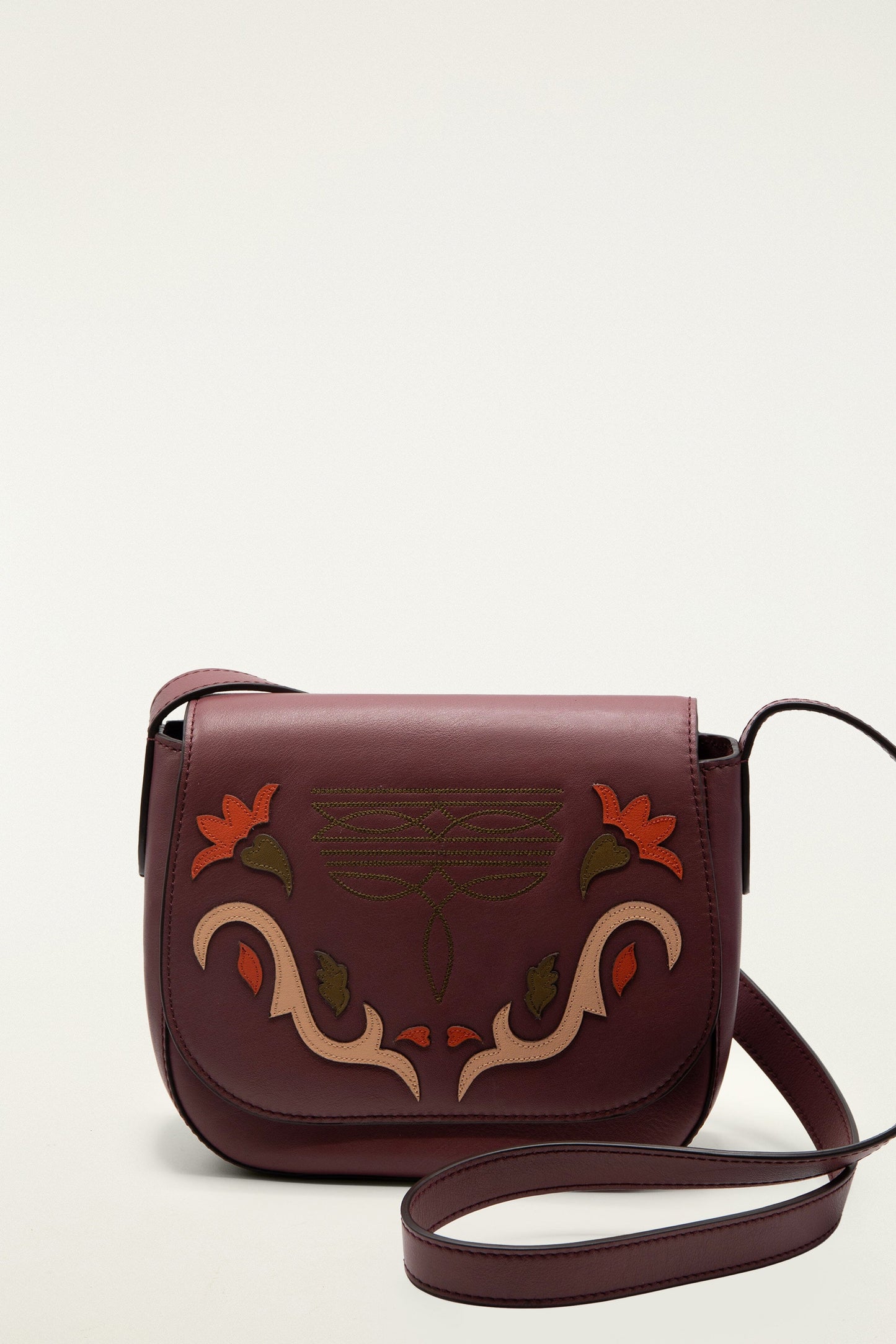 FARM Rio model wearing the Burgundy Western Embroidered Leather Crossbody Bag