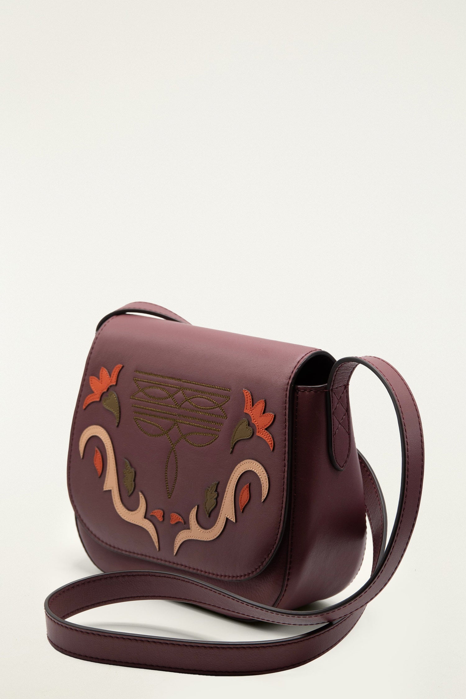 FARM Rio model wearing the Burgundy Western Embroidered Leather Crossbody Bag