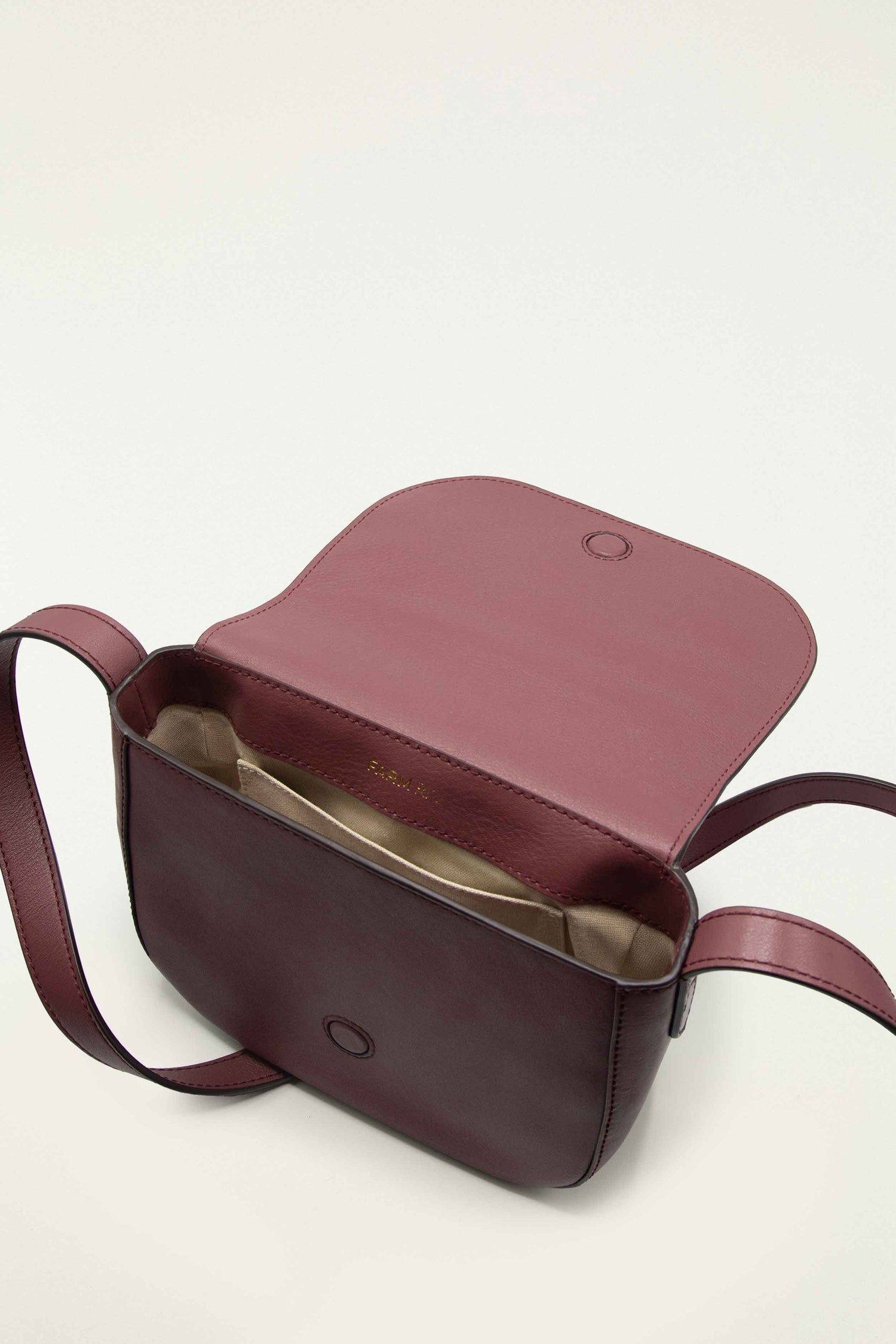 FARM Rio model wearing the Burgundy Western Embroidered Leather Crossbody Bag