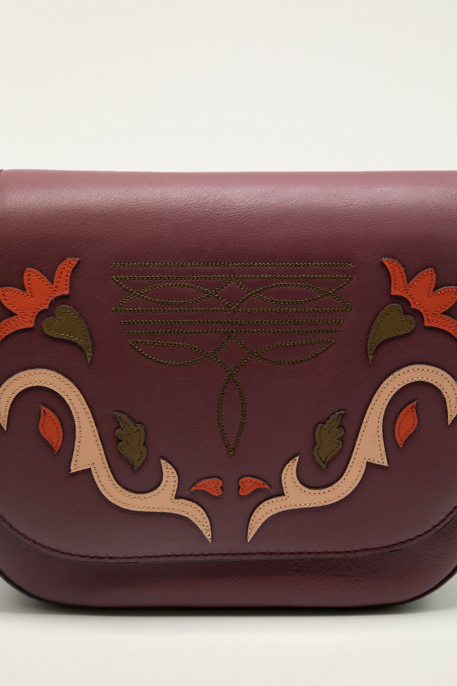 FARM Rio model wearing the Burgundy Western Embroidered Leather Crossbody Bag