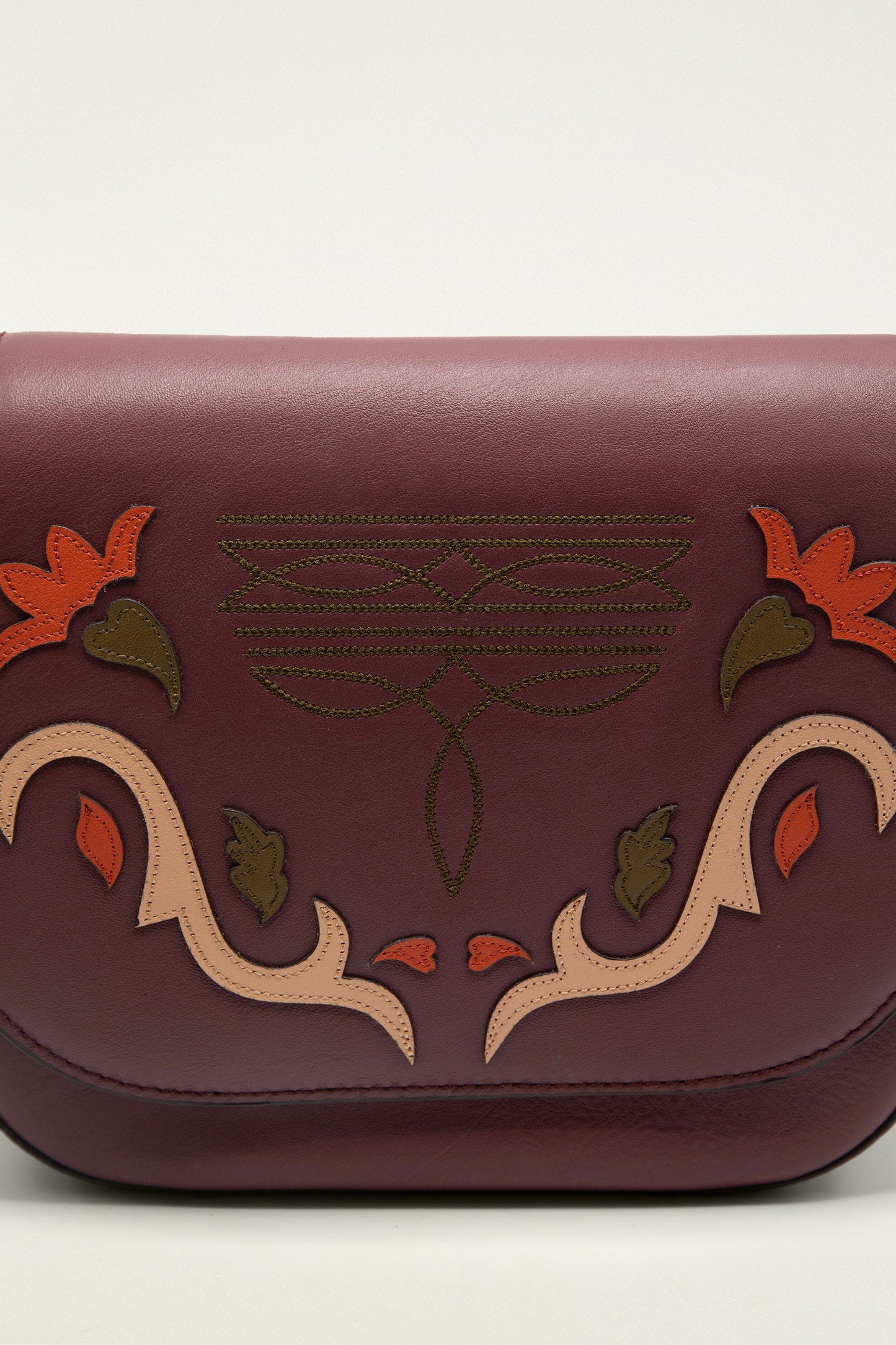 FARM Rio model wearing the Burgundy Western Embroidered Leather Crossbody Bag