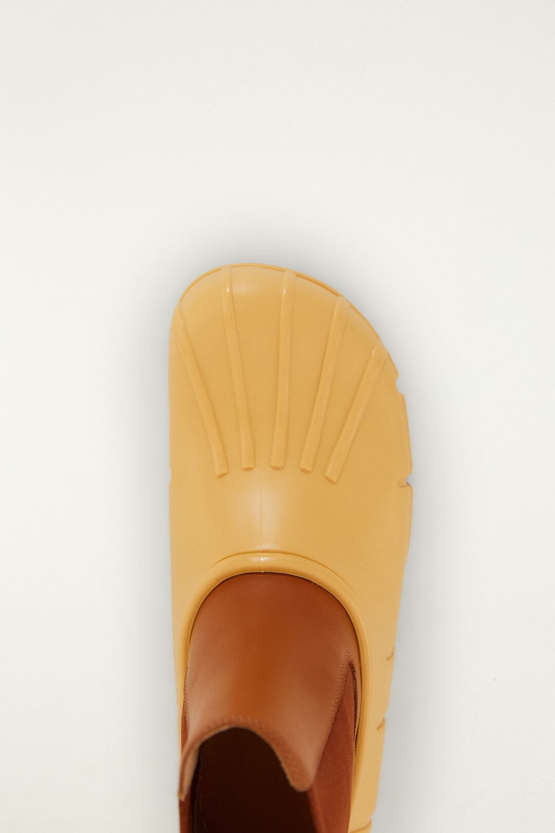 FARM Rio model wearing the Butter Yellow Monstera Rain Chelsea Boot