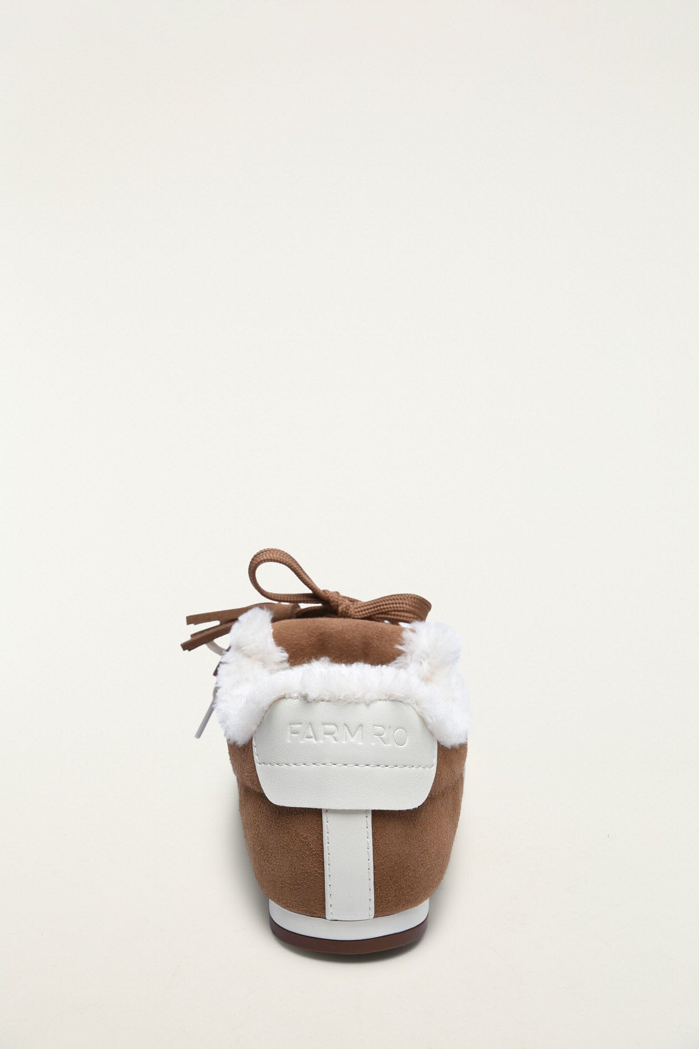 FARM Rio model wearing the Farm Shearling Sneakerina