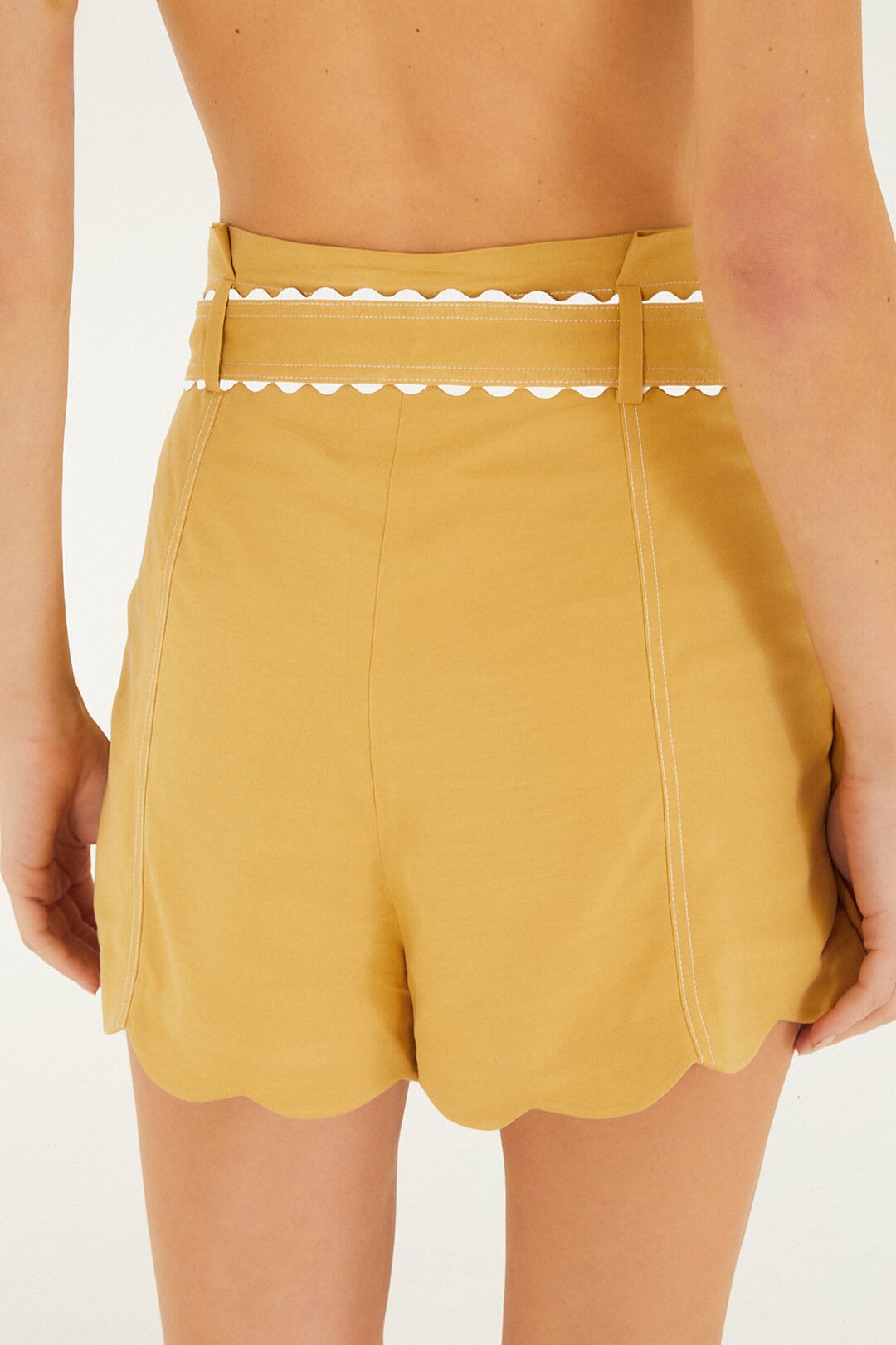 FARM Rio model wearing the Khaki High Waist Belted Scalloped Shorts
