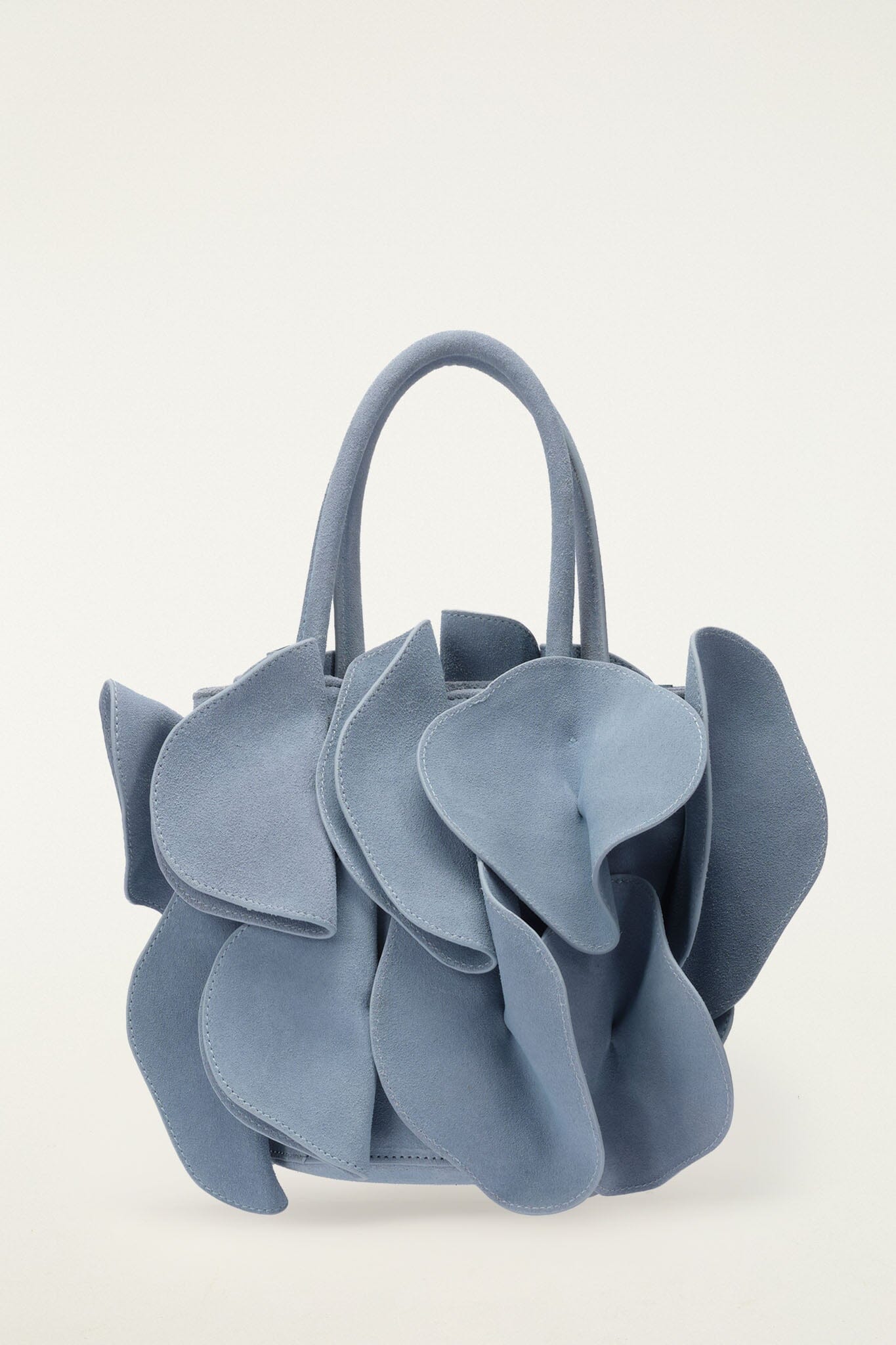 FARM Rio model wearing the Light Blue Suede Flower Handbag