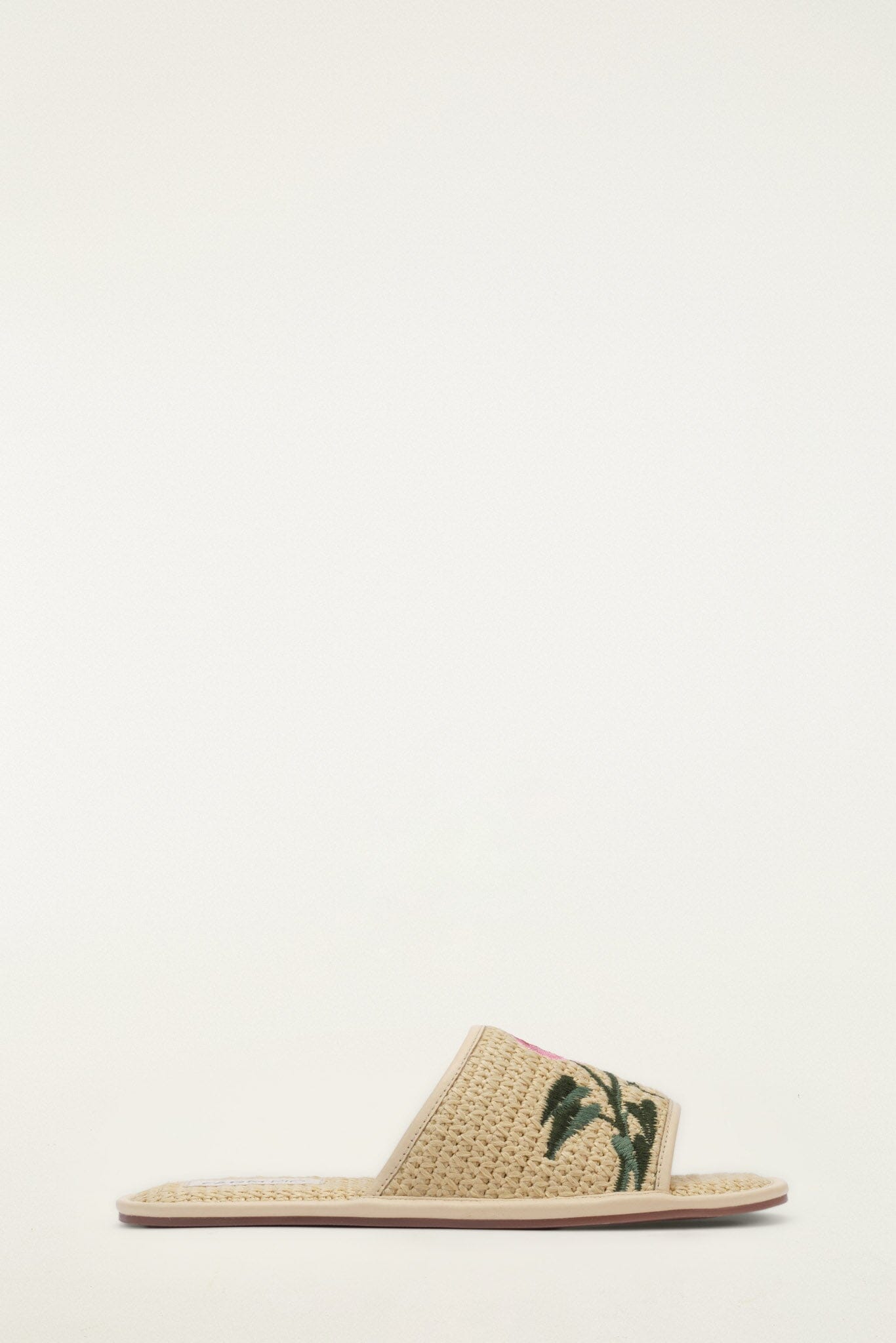 FARM Rio model wearing the Raffia Farm Hotel Embroidered Slide Sandal