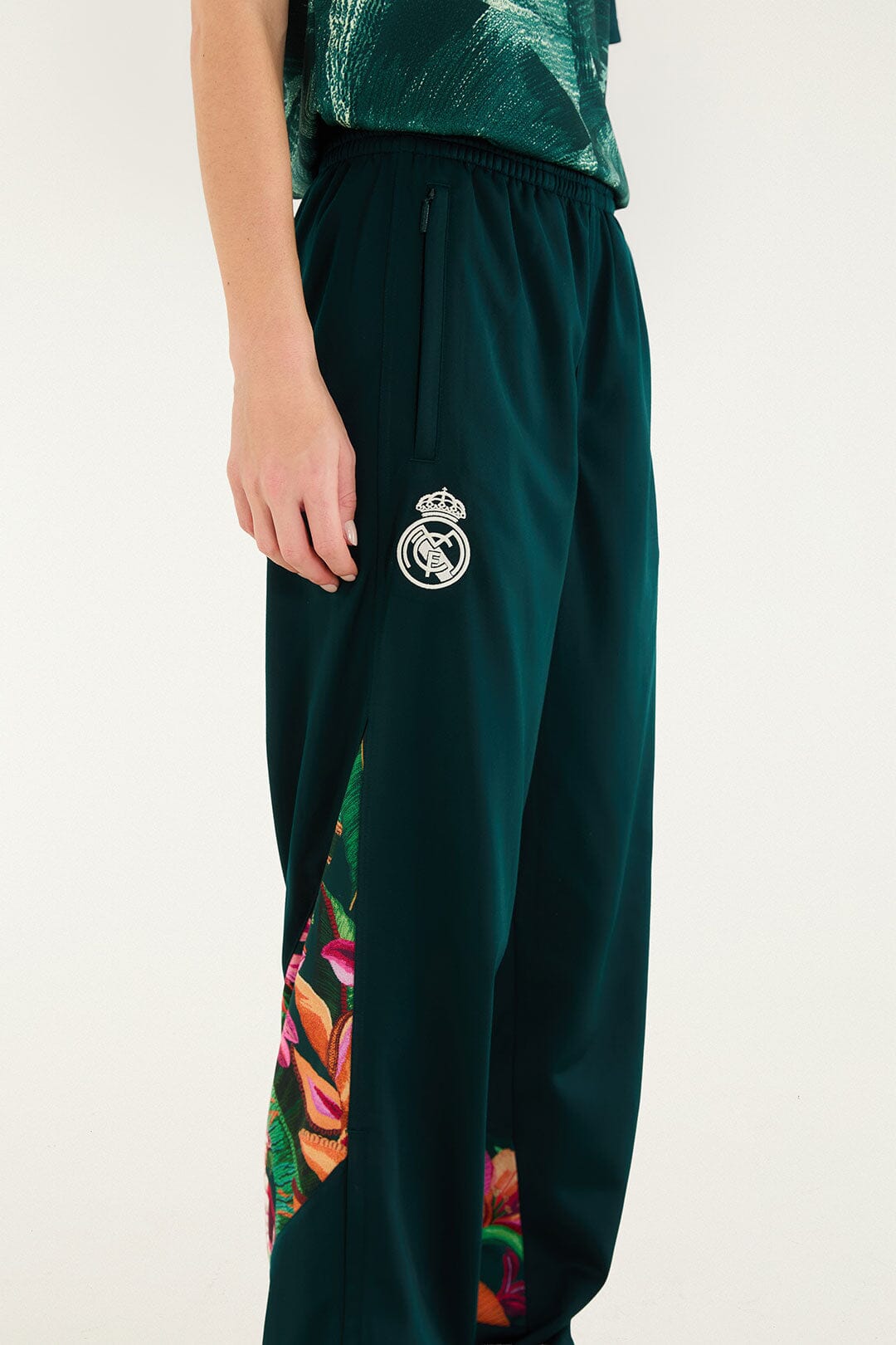 FARM Rio model wearing the Real Foliage Green Adidas Pants