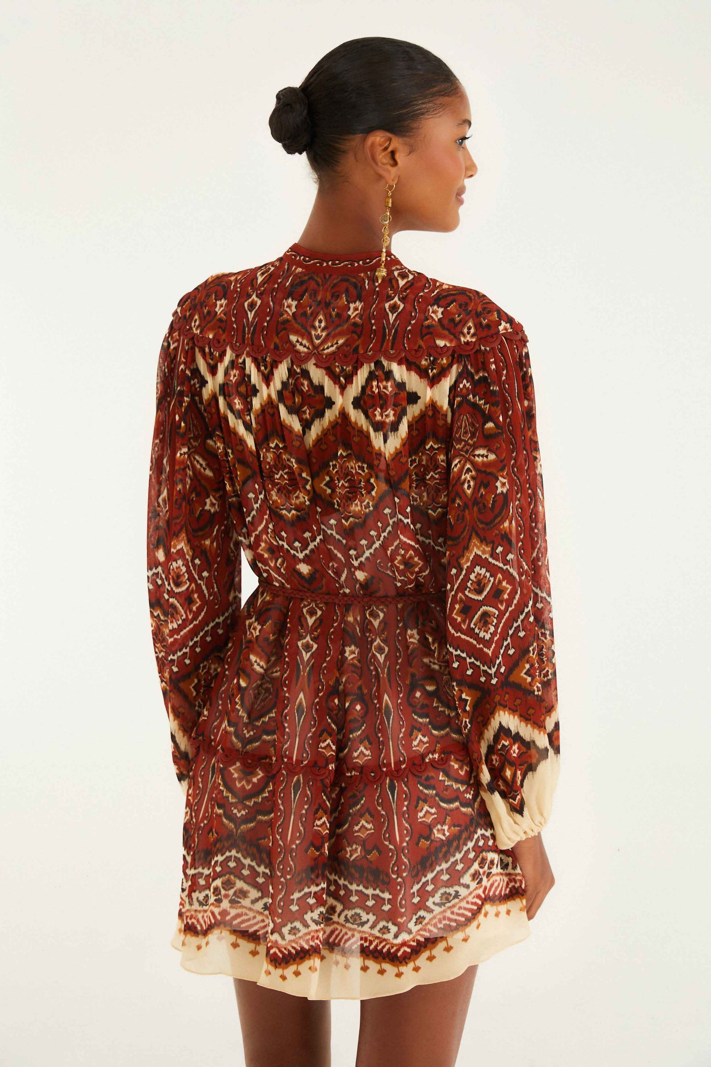 FARM Rio model wearing the Sand Ainika Pineapple Tapestry Long Sleeve Mini Dress