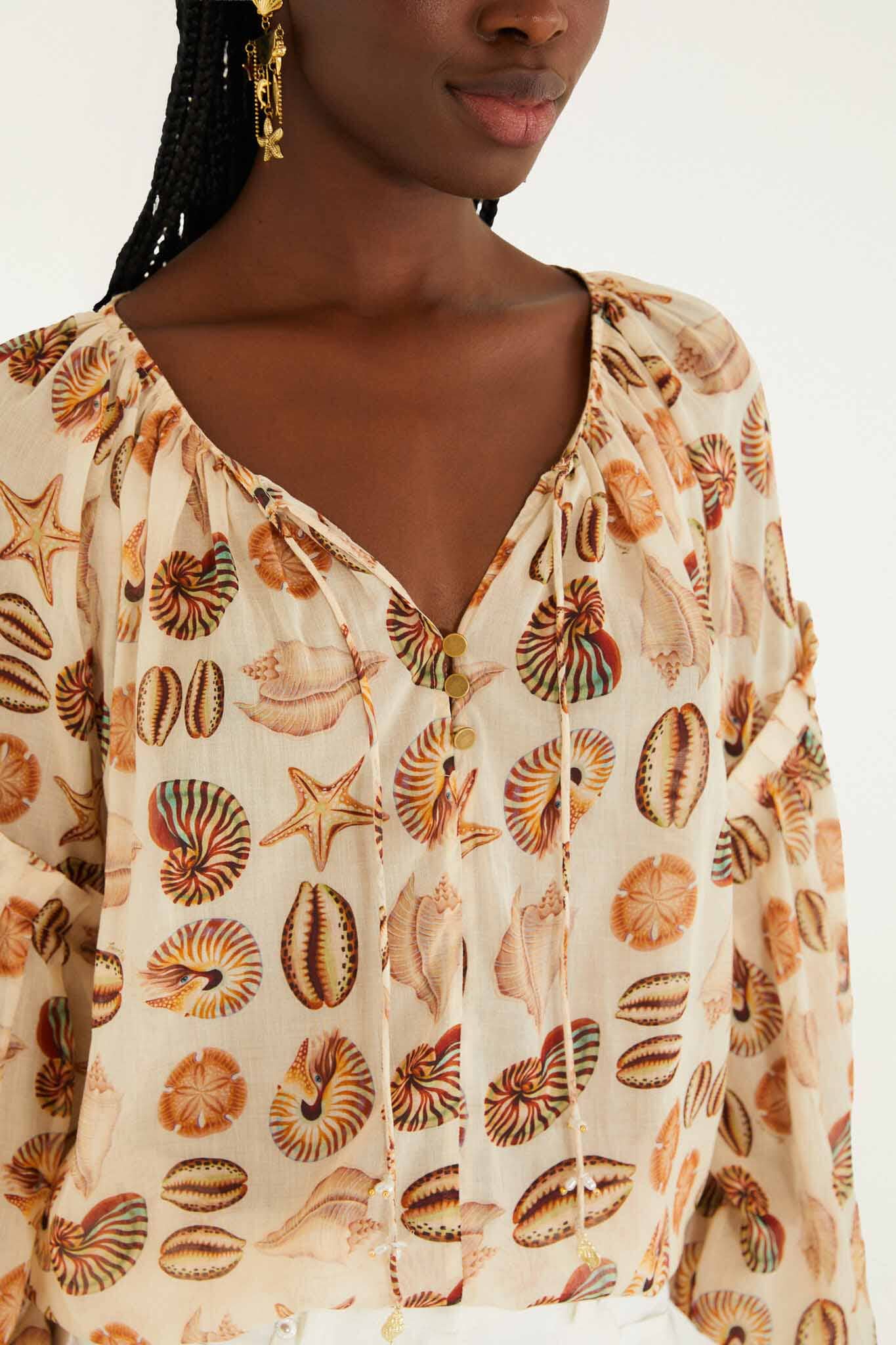 FARM Rio model wearing the Sand Marine Shells Beaded Ties Blouse